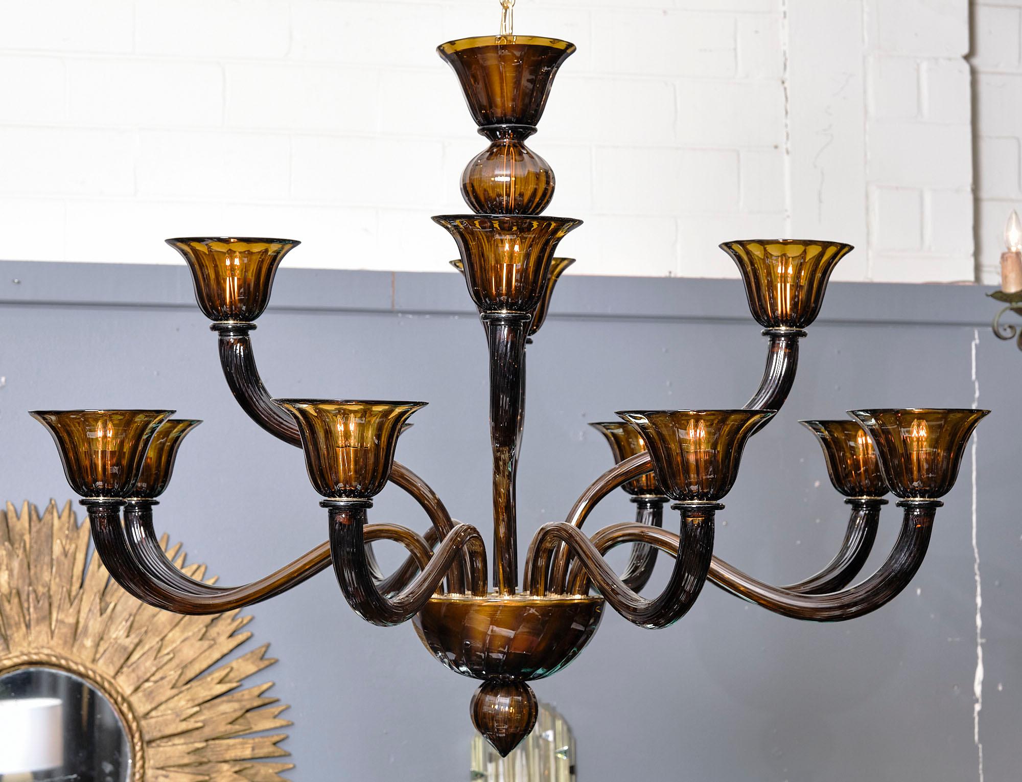 Chandelier from the island of Murano made of all original hand-blown glass in tobacco colored glass. There are 12 branches and this piece has been newly wired to fit US standards. The overall height is currently 57
