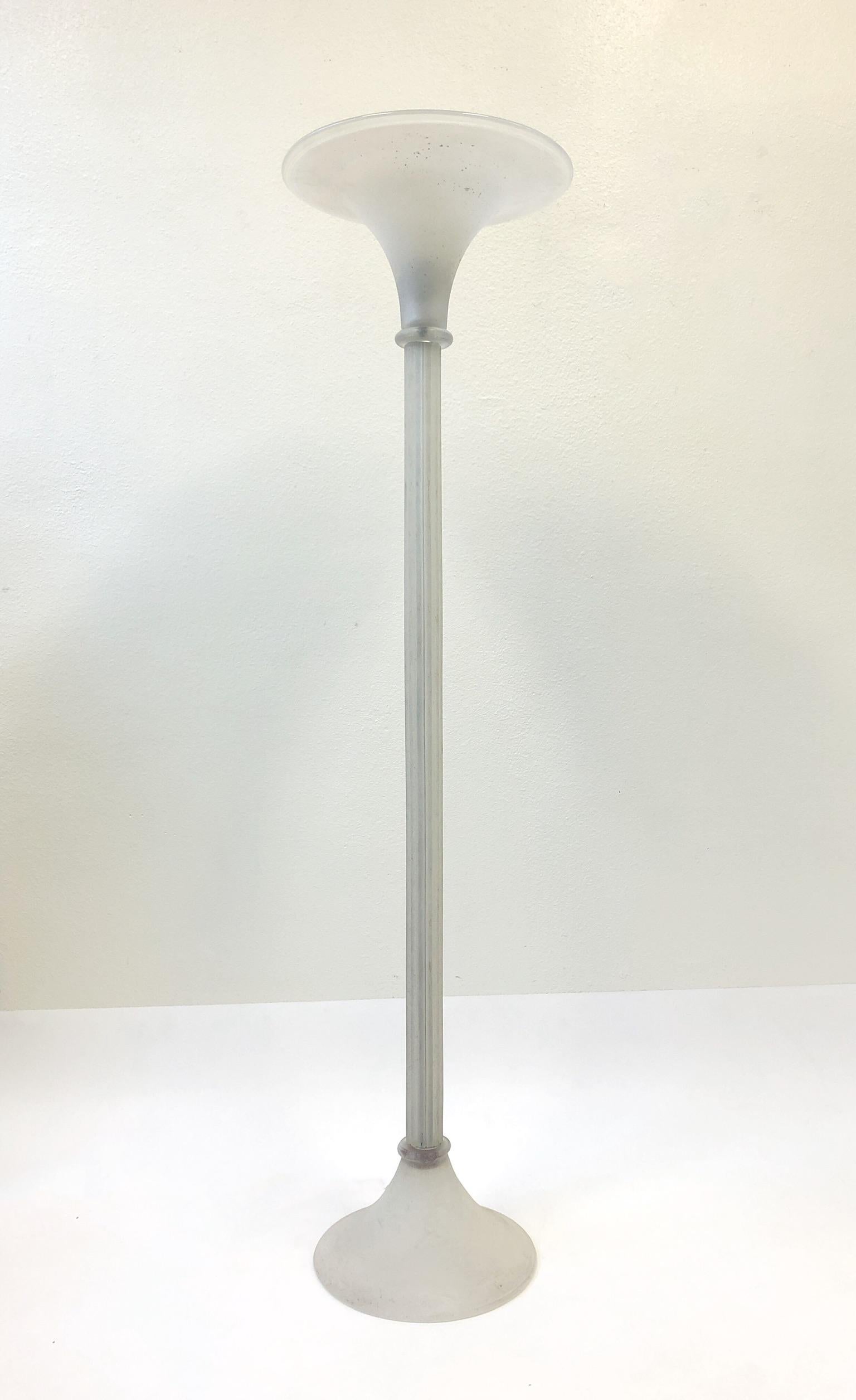 A glamorous Murano scavo glass torchère floor lamp designed by Karl Springer in the 1980s for Seguso Italy.
The lamp is signed by Karl Springer. The lamp takes a regular Edison lightbulb and it has a full range inline dimmer.
Dimensions: 67.5”