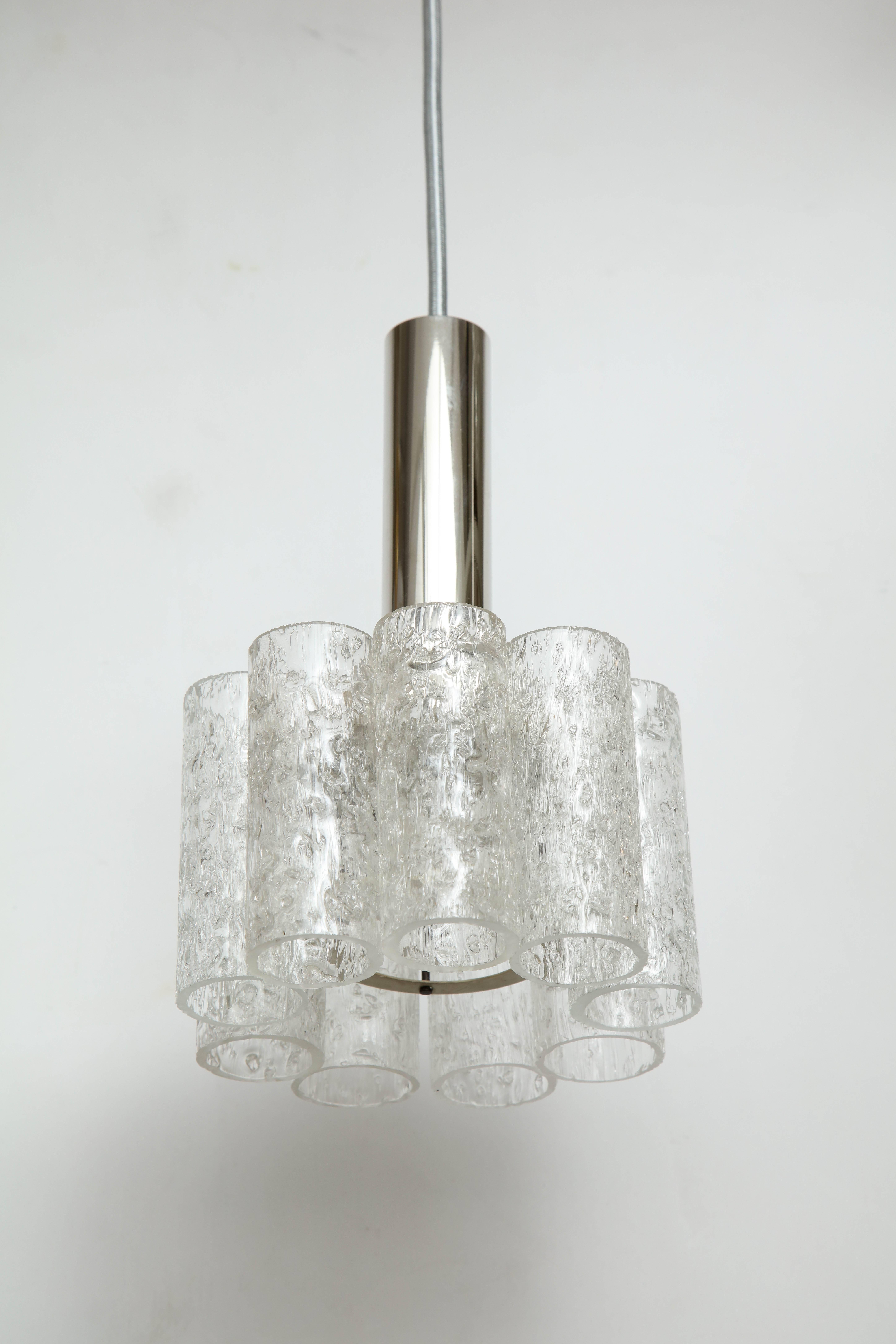 Midcentury Murano ice glass tube pendants with polished nickel collars and canopies. Pendants have been rewired for use in the USA with silver cord, one-light source, 60W max. Length is adjustable. Length of glass body and collar is 9