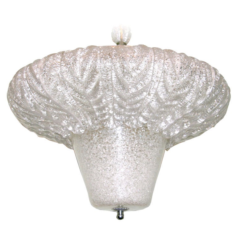 A large Murano glass Italian made fixture. Individual bent glass leaves ending over a cone shaped center. 
