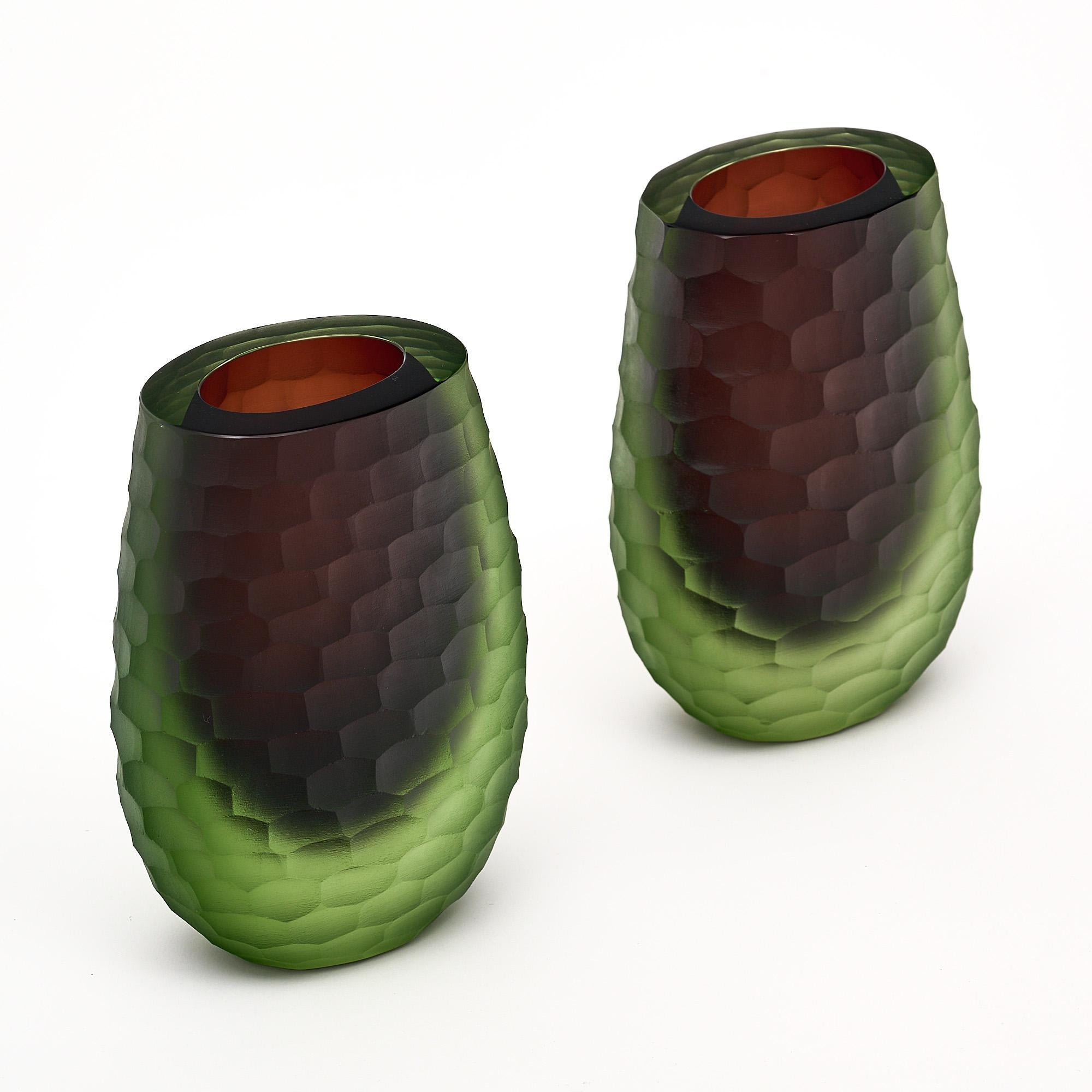 Pair of vases, Italian, from the Island of Murano. This pair is hand-crafted by combining the “Sommerso” technique and the Ferro Battuto technique, originally initiated by iconic designer Ettore Sottsass. We love the thickness of the glass and the