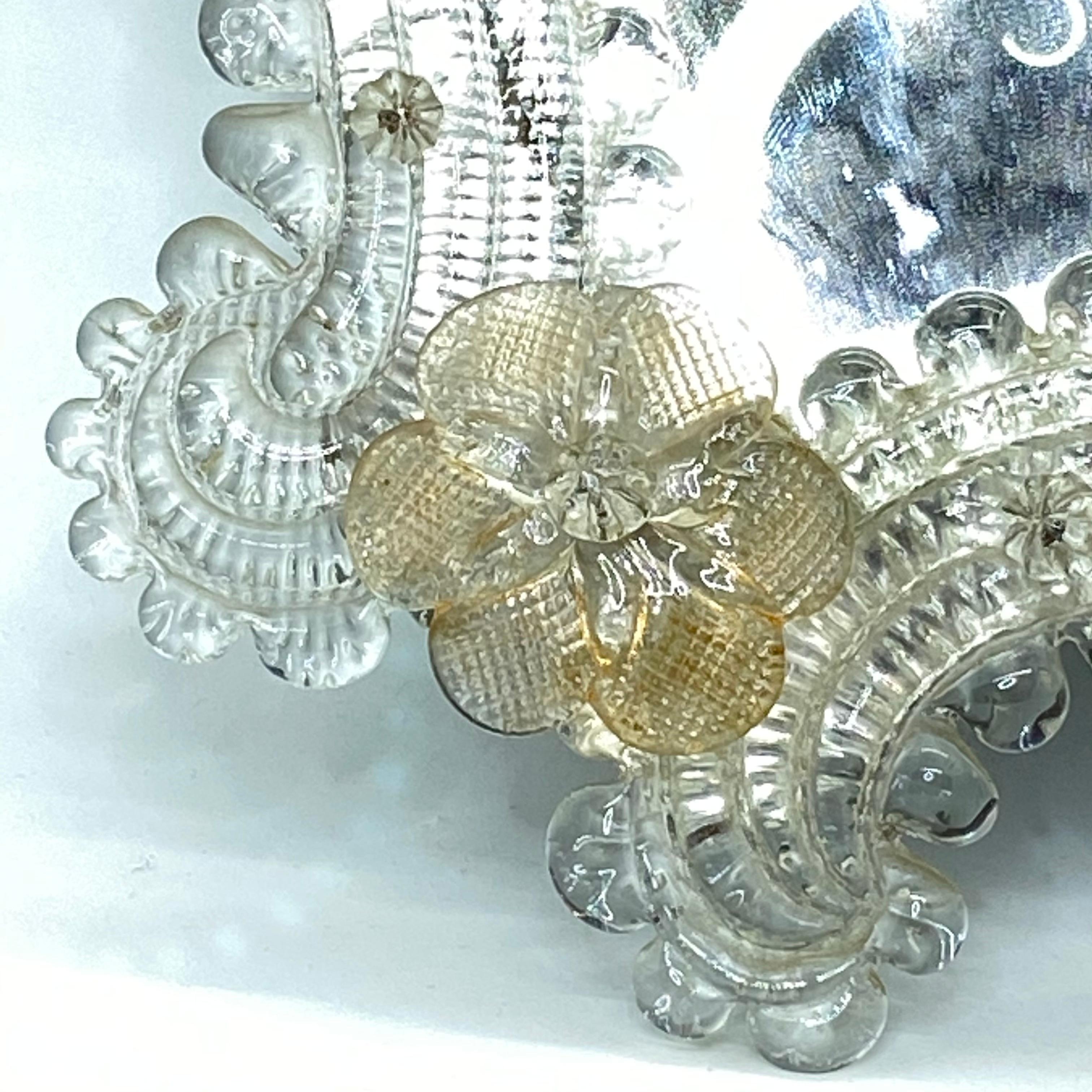 A gorgeous Murano glass vanity mirror surrounded with handmade gold flake flowers. With minor signs of wear as expected with age and use. A nice addition to any boudoir.