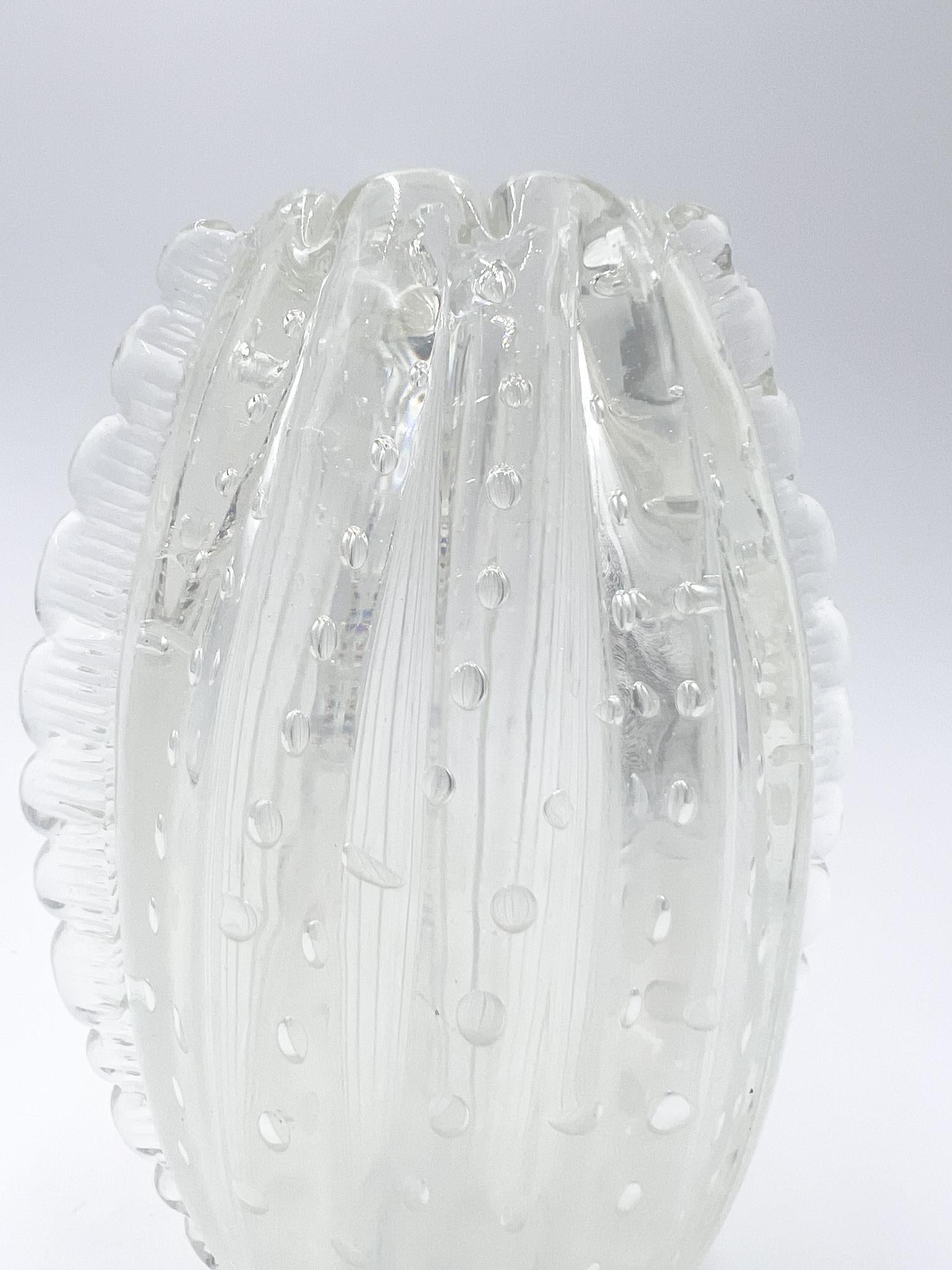 Transparent Murano glass vase with bubble processing, made by Barovier in the 1960s

Ø 13 cm h 20 cm

Barovier & Toso is a glass factory, known for its handcrafted collections of decorative Murano glass in the 20th century. The chemical