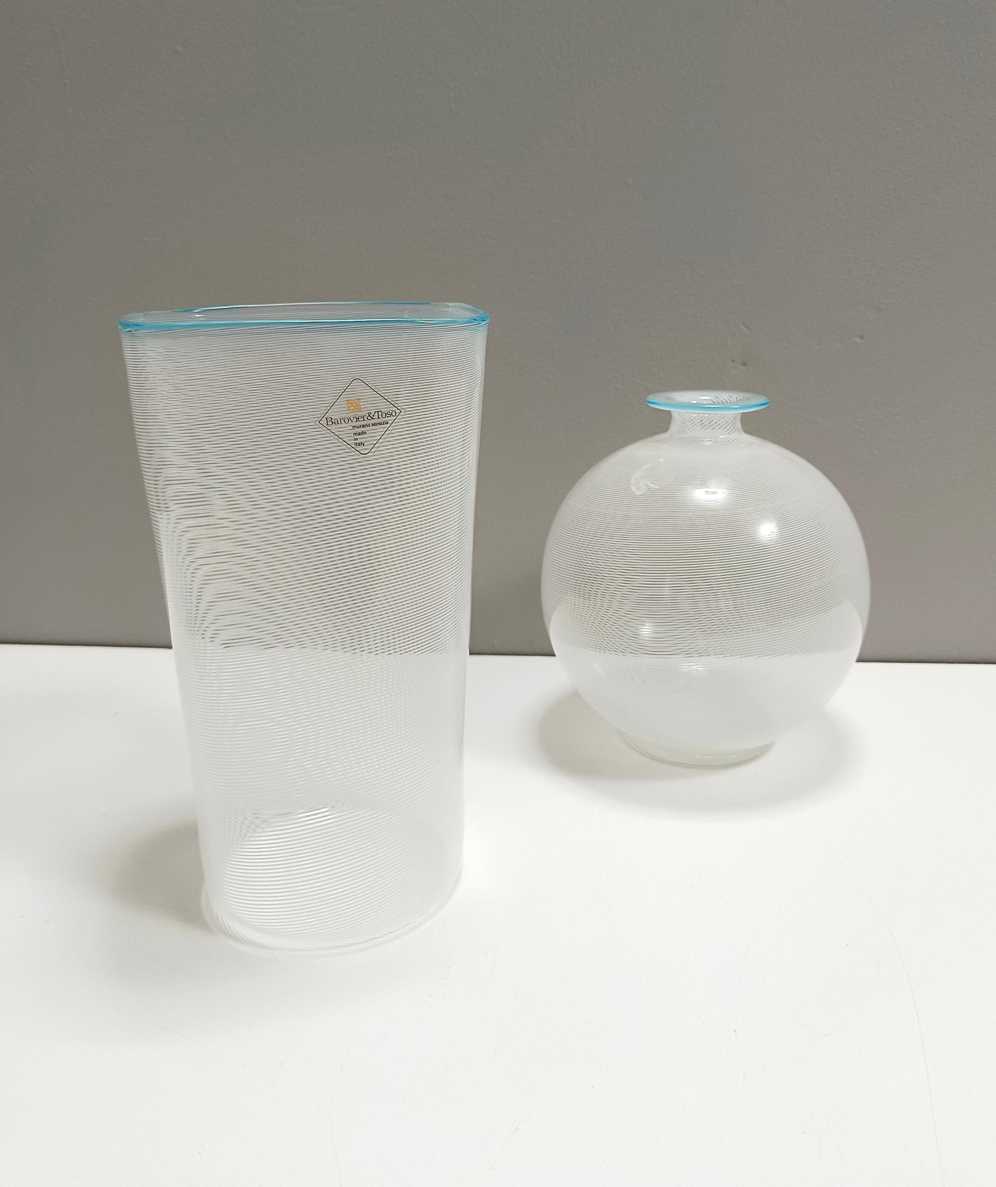 Made in Italy, 1970s. 
This is an extremely fine vase, designed by Ercole Barovier for Barovier & Toso's company in Murano. 
It is made in hand-blown glass with white canes. 
This is a vintage piece, therefore it might show slight traces of use,