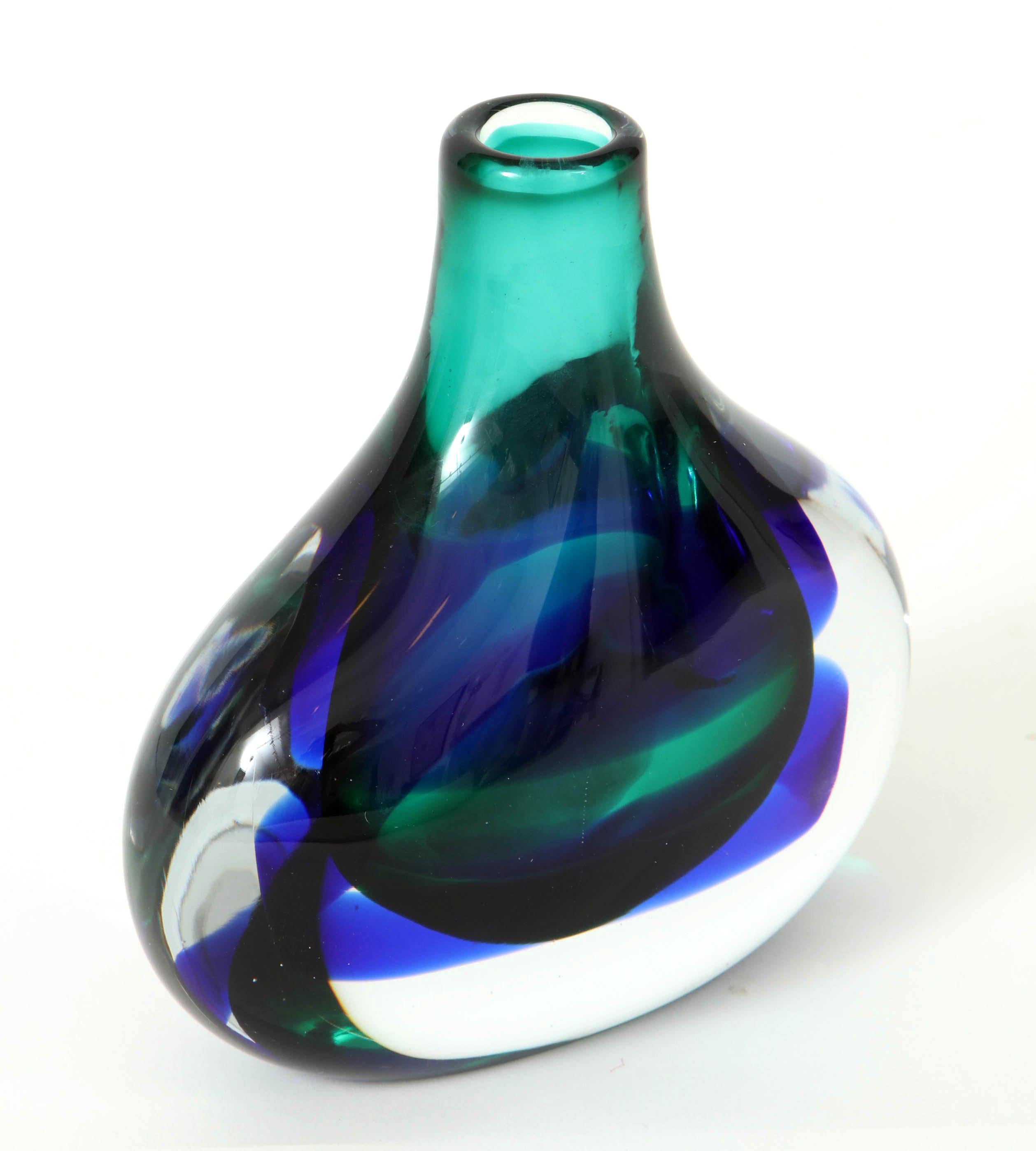 Stunning Murano glass vase in jewel colors by the talented Luciano Gaspari by Salviati. Beautiful and chunky flask shaped vase in royal blue and soft greens with geometric patterns. Signed. Great piece that works well with other Murano glass pieces.