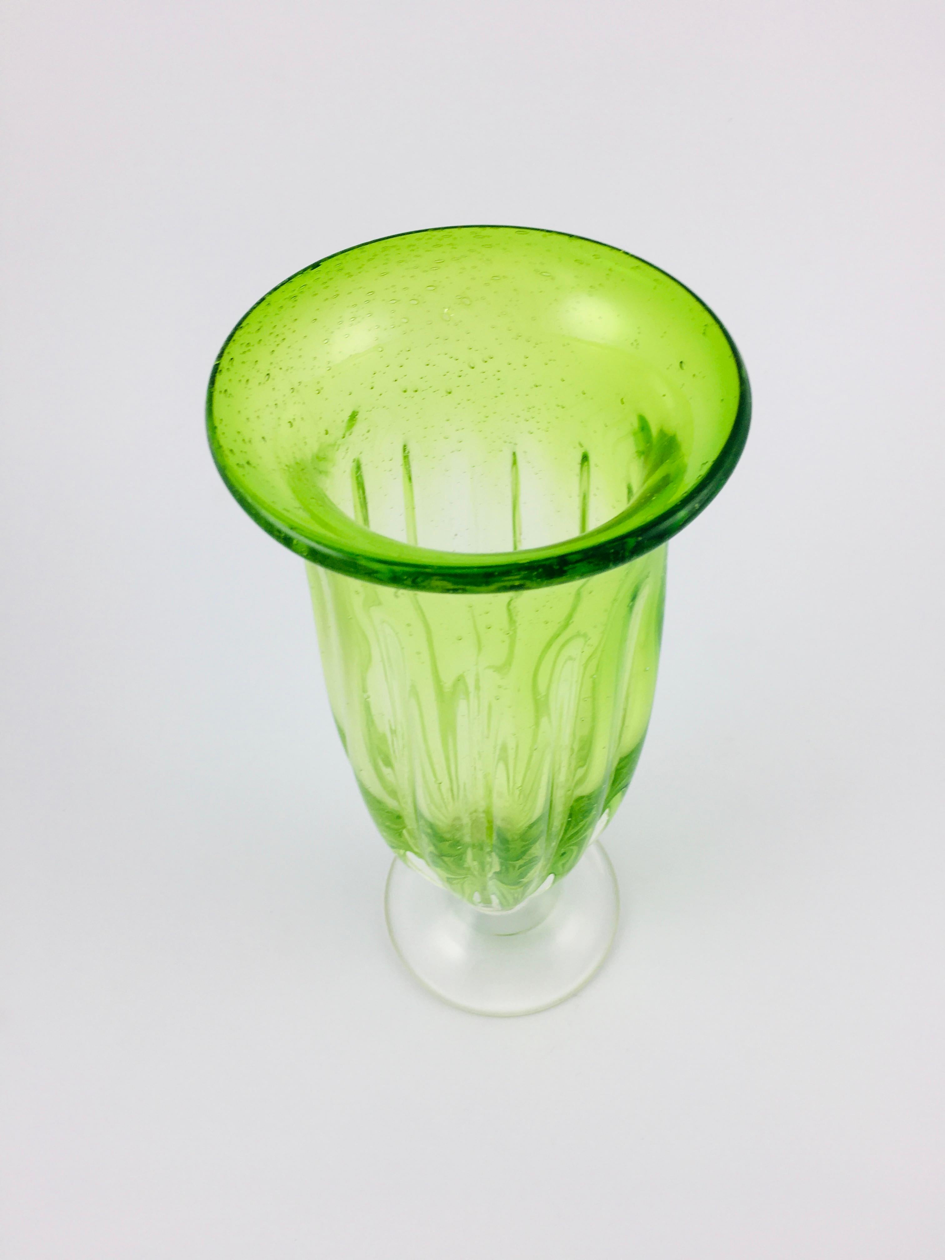 Handmade large Italian Murano glass vase in green color. Special vintage large vase with uranium green inner glass layer. Handmade glass, also excellent for decoration. In perfect condition, a rare piece. Glass vase with ribbed sides, handmade.