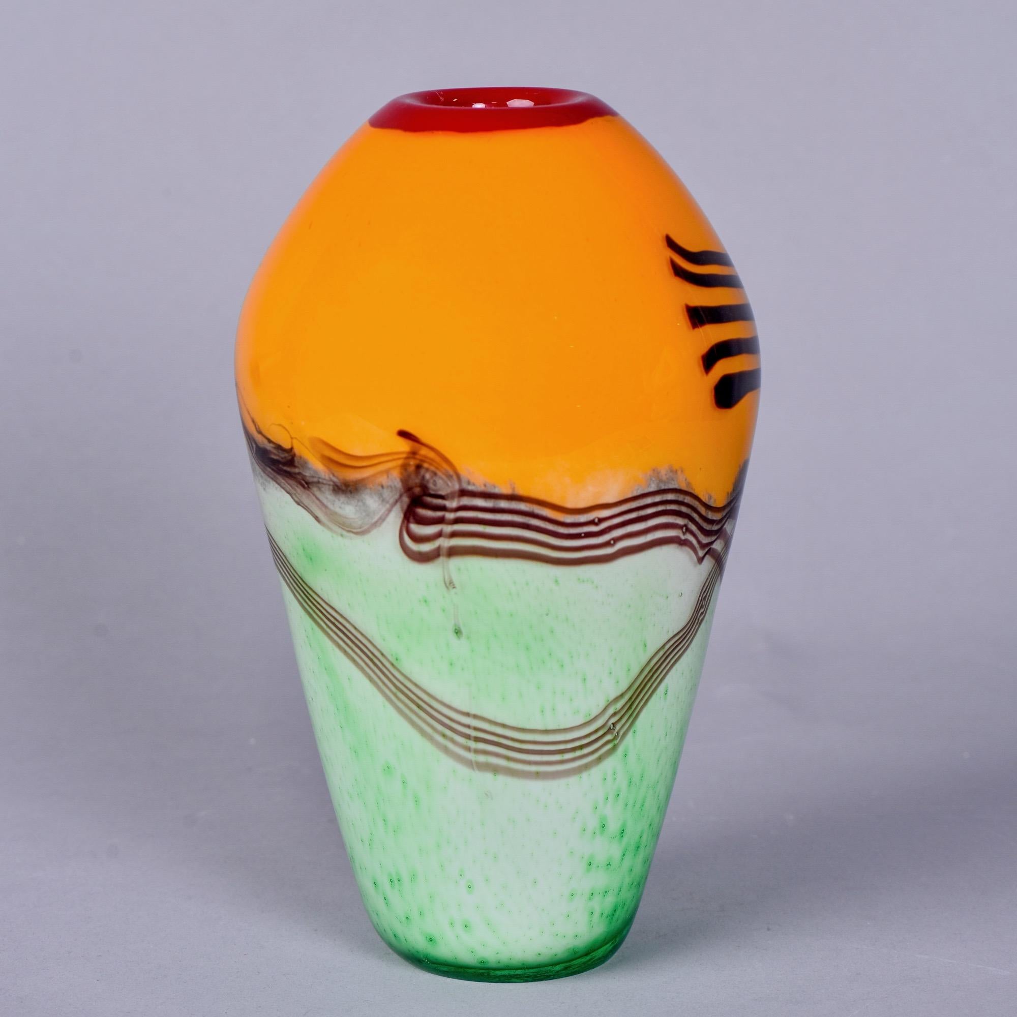 Vibrantly colored Murano glass vase features a mint green vase, tangerine top and red lip with black accent stripes, circa 2019. Unsigned, unknown Murano maker.