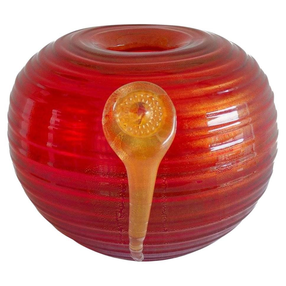 Murano glass vase in vibrant red adorned by a central gold pendant Italy 1980s For Sale