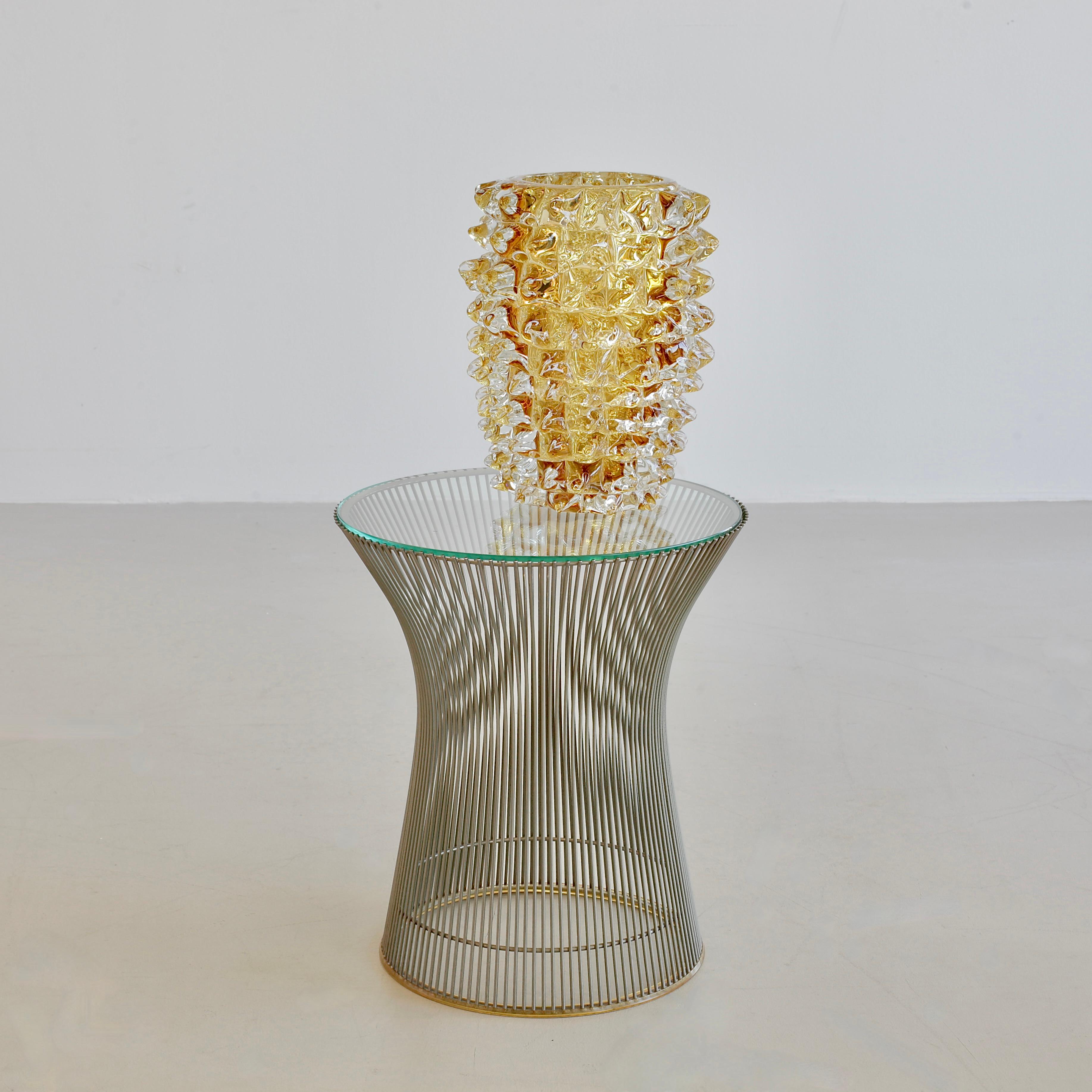 Large hand-blown glass vase, Italy, Murano.

Yellow glass vase with spikes, engraved with signature on base. Heavy and decorative piece, made in Murano.

 