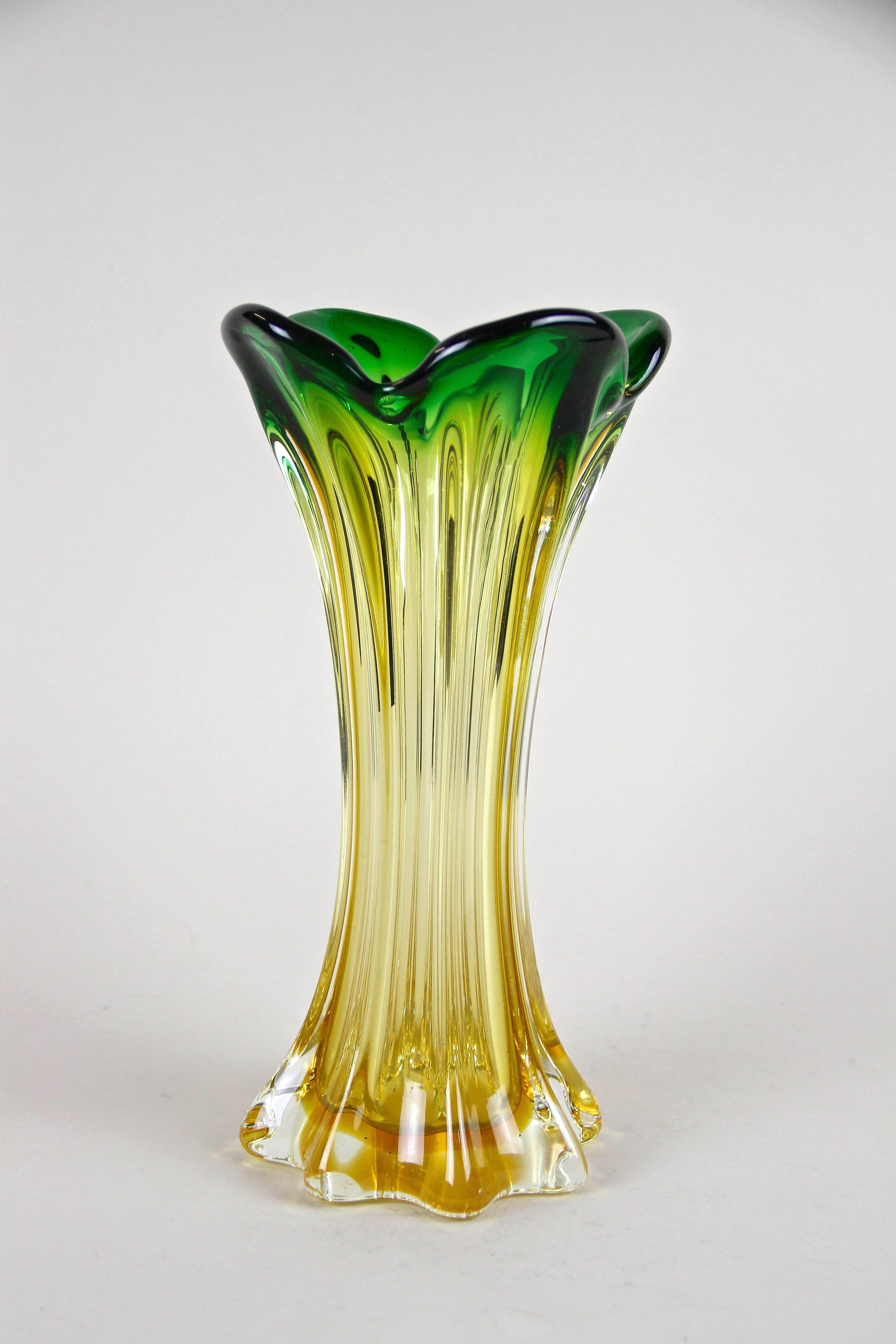 Fantastic looking, large Mid-Century Murano Glass Vase out of the renown glass art workshops of Sommerso in Venetia. Artfully made in Italy around 1960/70 this lovely shaped glass vase impresses with an amazing coloration going from a beautiful