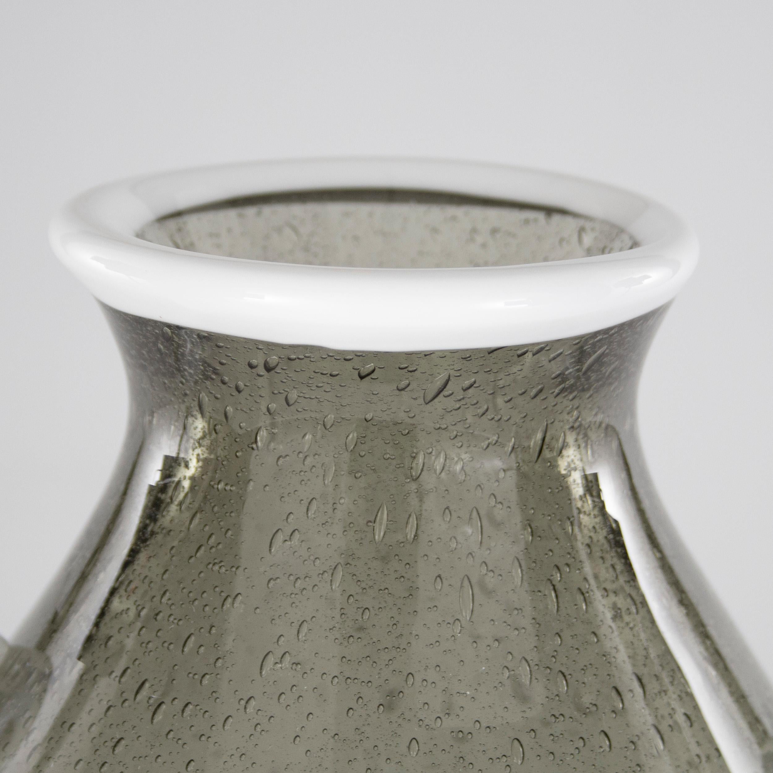 Murano glass Vintage vase Pulegoso and grey milk glass in the style of Martinuzzi for Venini

Additional information:
Material: Murano Glass, Milk Glass, Mouth Blown Glass
Style: Vintage, Mid-Century modern
Color: Grey and white
Designer: Napoleon