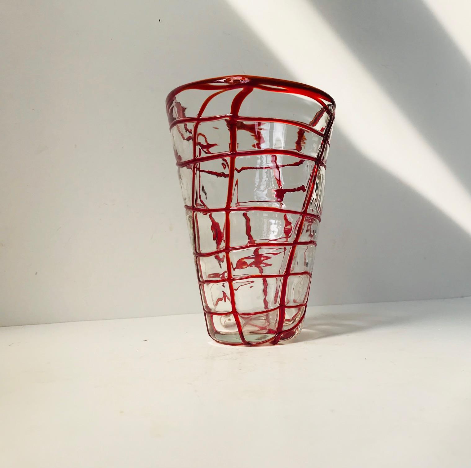 - A hand blown clear glass vase with red web on-lay
- Manufactured in Murano, Italy, during the 1970s
- In a style reminiscent of Carlo Moretti.