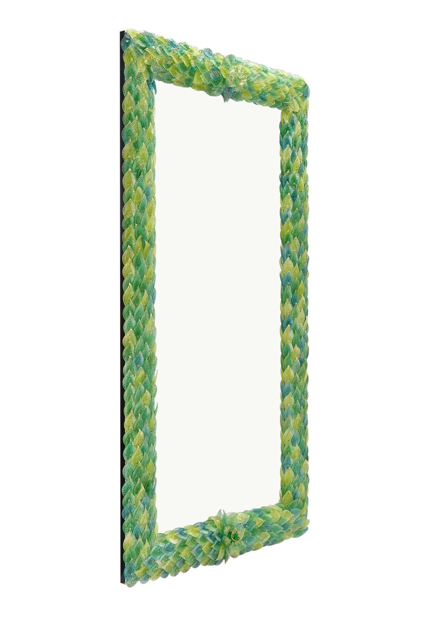 Mirror, Veneitan, from the island of Murano featuring a rich array of green and yellow hand-made glass leaves fused with 24 carat gold leafing.
