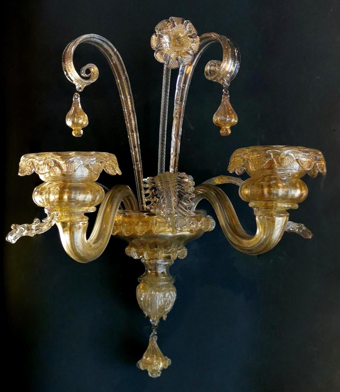 We kindly suggest that you read the whole description, as with it we try to give you detailed technical and historical information to guarantee the authenticity of our objects.
Valuable and precious Murano glass wall sconce made in a graceful Art