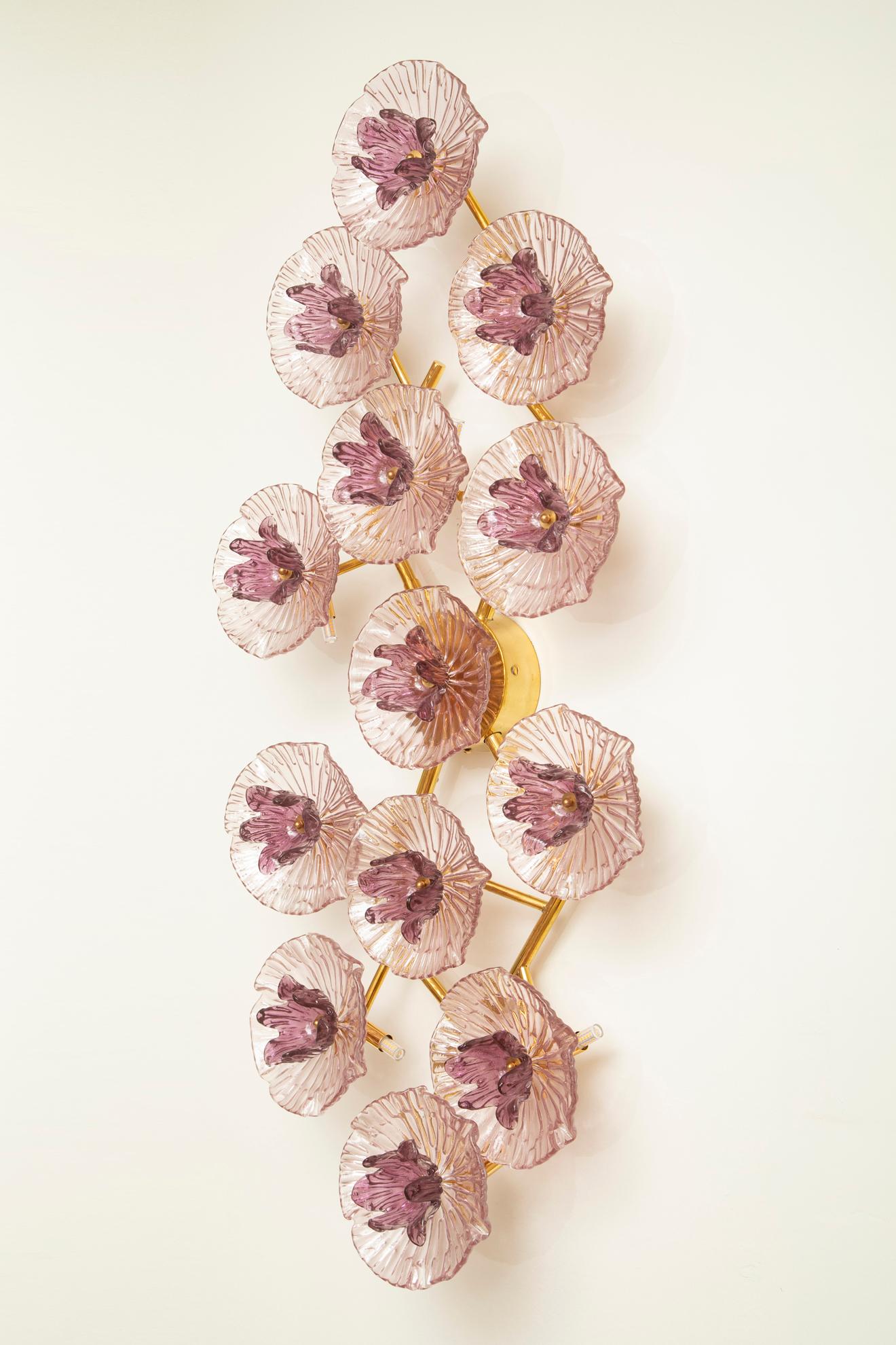 Murano glass wall sconce or flush mount chandelier, contemporary, in stock
Striking Murano glass light sculpture composed of amethyst-toned, textured glass florets with sculptural depth and organic form. Each flower features a richly colored purple