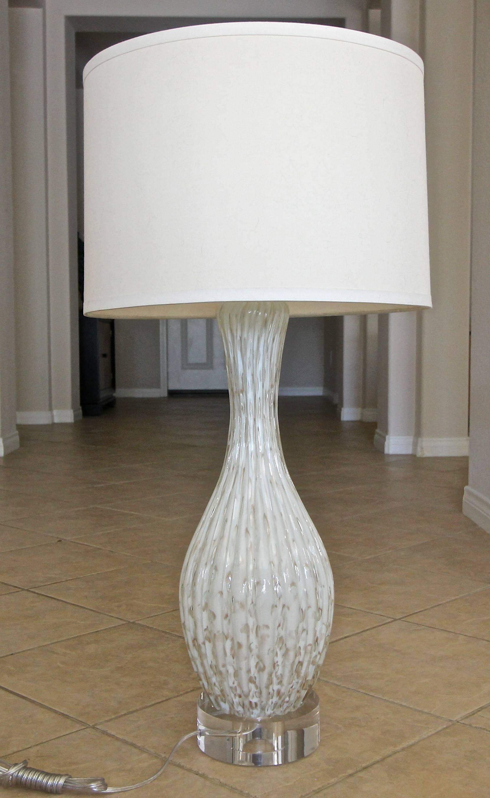 Taller scale Murano Italian handblown white colored glass table lamp with aventurine inclusions and controlled bubbles throughout on thick custom acrylic base. Rewired with all new fittings including new three way brass socket and cord. Size of