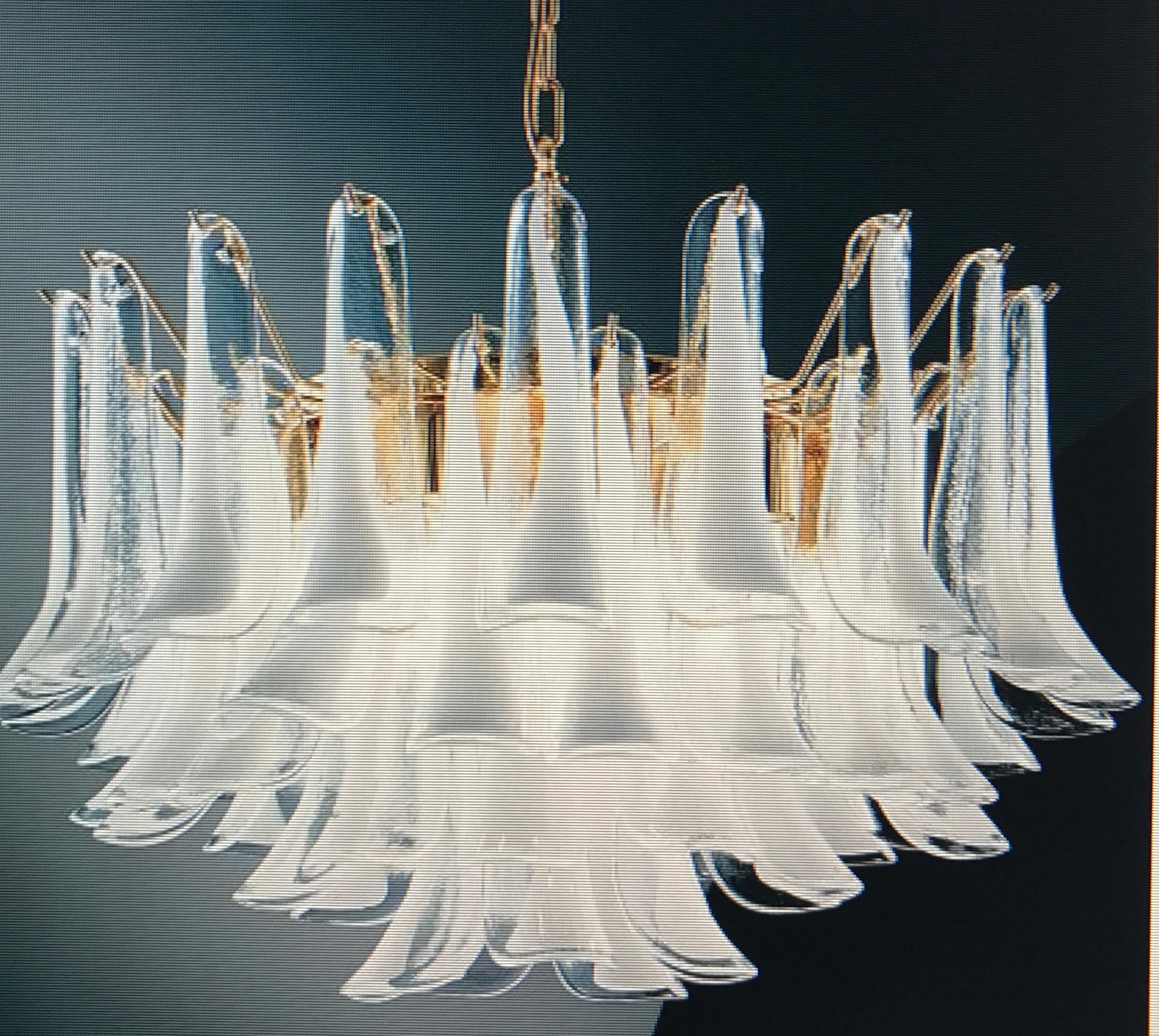 Amazing chandelier with 49 petals white hand blown glass by Murano.

Measures: height with chain cm 80, ( 31.5 in. ) without chain cm54 (21 in.) diameter cm 65 (25.6 in.)
Five E27 light bulbs.
available also a pair.
 
  