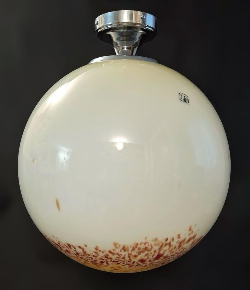 Vintage Italian cream colored Murano glass globe pendant with yellow, orange, and red decorations / Designed by De Majo Murano, made in Italy circa 1960s
Original label on the glass
Diameter: 20 inches / Height: 22 inches plus chain and canopy
1