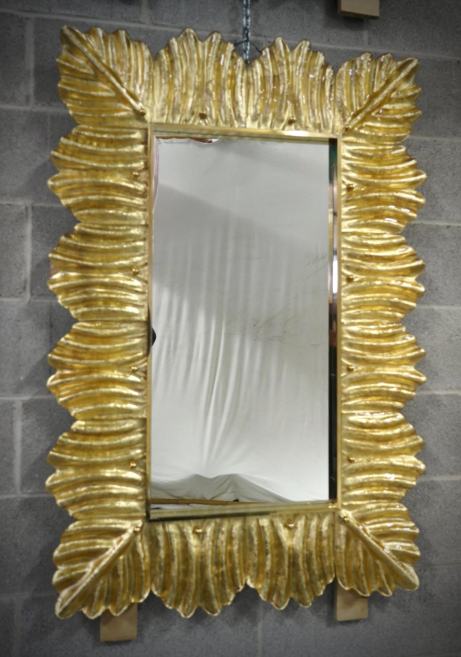 A gold color frame, reach the eye of the beholder, leaving him entranced; of Murano blu art glass wall mirror. Beautifully shaped and of excellent size, the wall mirror is a real design object.

The structure of the wall mirror is in wood, where the