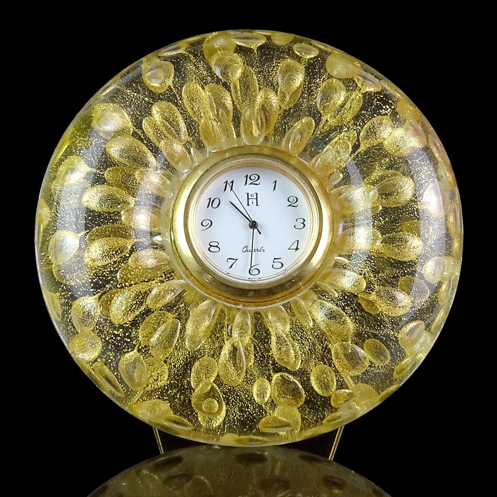 Beautiful Murano hand blown controlled bubbles and gold flecks Italian art glass desk clock. It has a Quartz clock face, a triangle Stand on the back, and battery operated clock face (needs new battery). Great piece for any desk, bedside table or