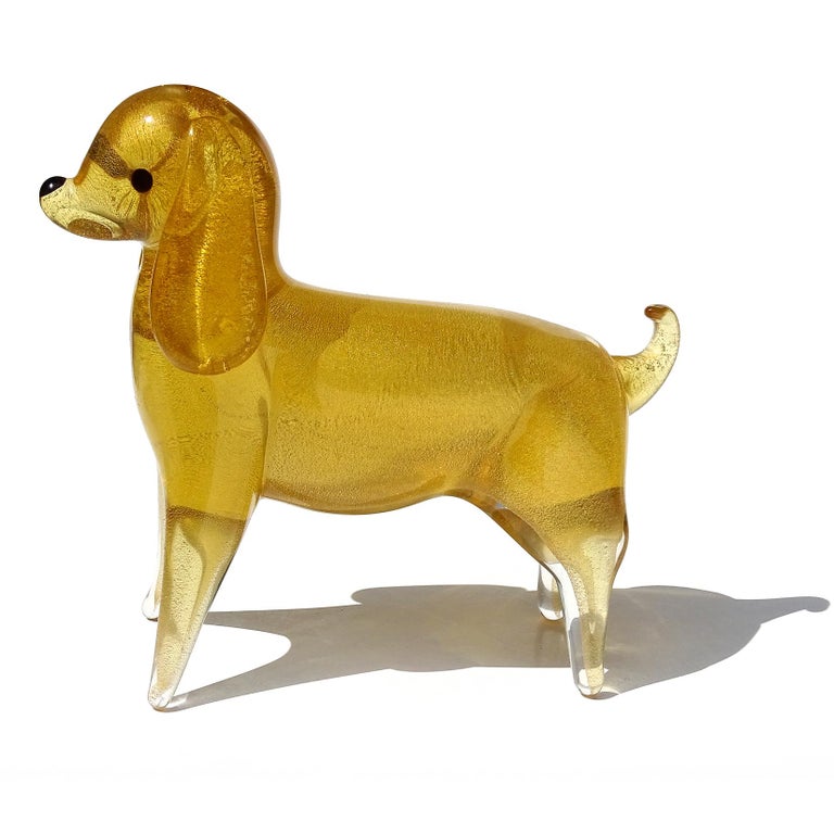 Beautiful vintage Murano hand blown Sommerso golden amber and gold flecks Italian art glass puppy dog sculpture / figurine. Created in the manner of designers Archimede Seguso and Alfredo Barbini. Profusely covered in gold leaf, with little black