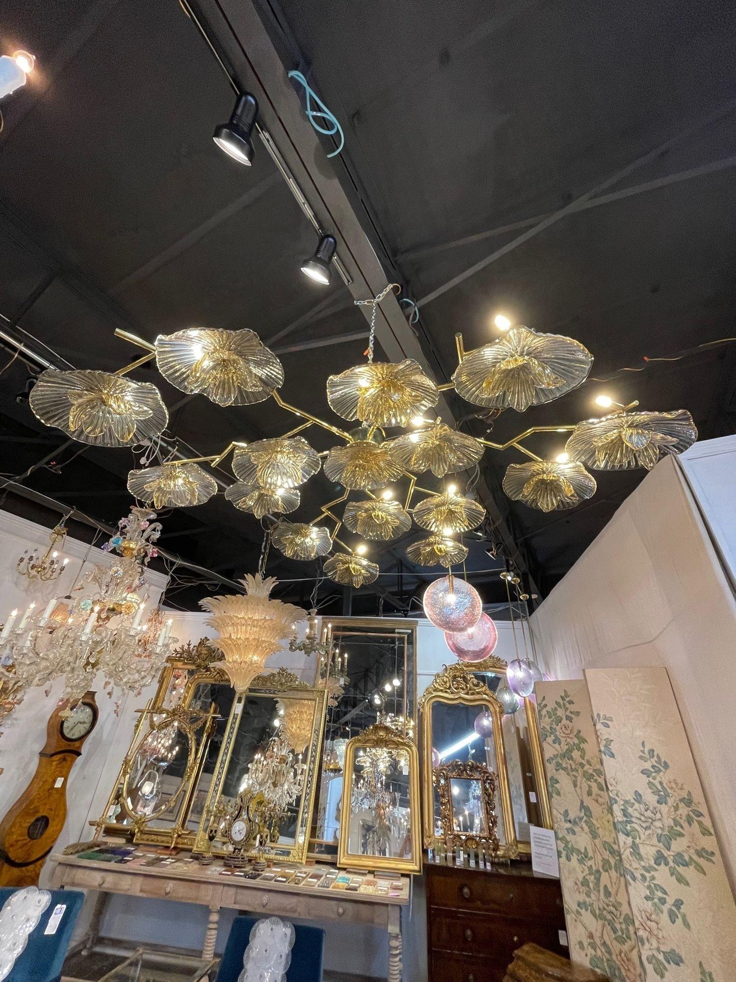 Fabulous modern Murano glass and brass gold flower chandelier (or wall art). Circa 2000. The chandelier has been professionally re-wired, cleaned and is ready to hang. Includes matching chain and canopy.