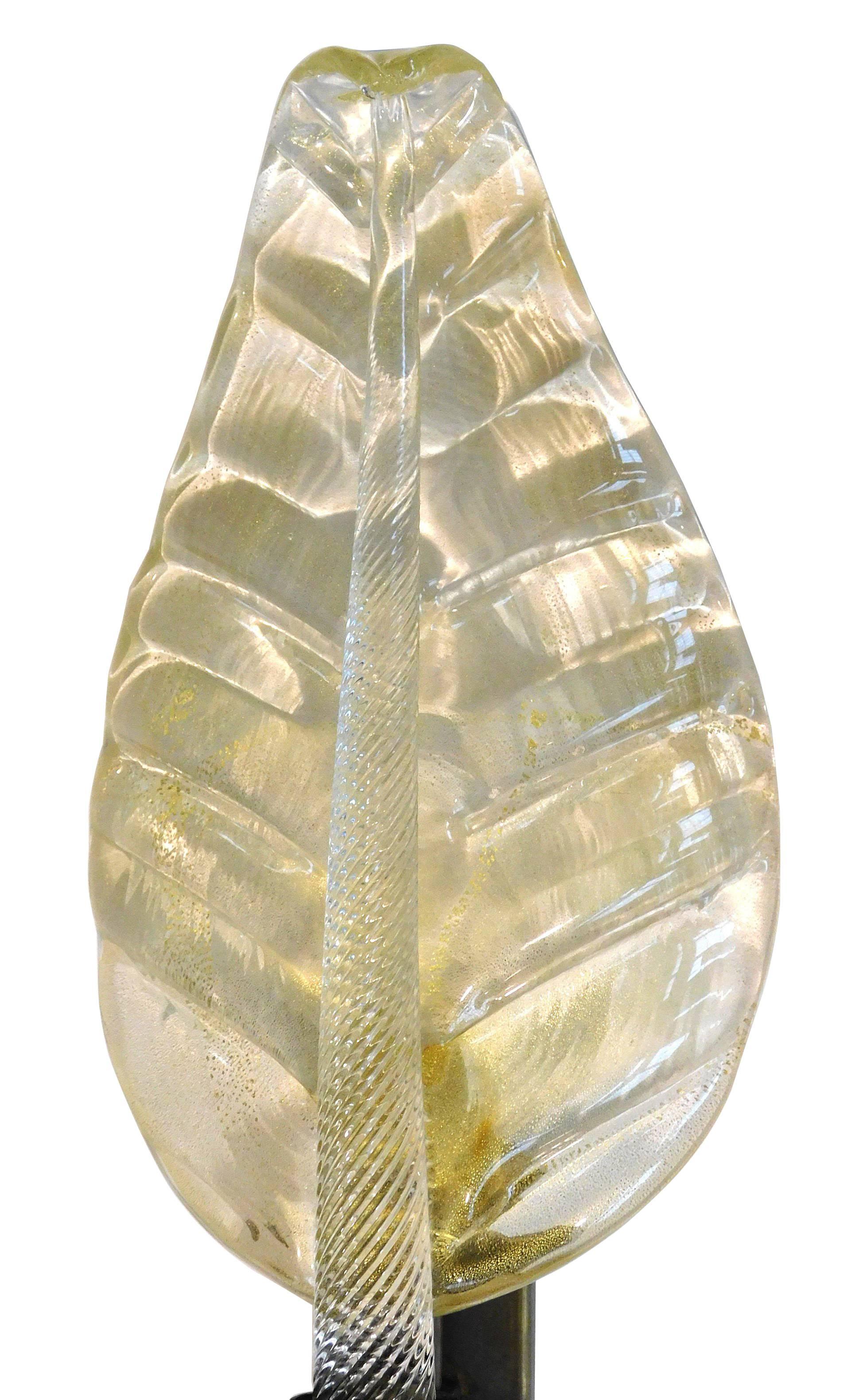 Italian leaf shaped wall light shown in hand blown Murano glass infused with 24-karat gold flecks mounted on bronze frame by Fabio Ltd / Made in Italy
1 light / E14 or E12 type / max 40W each
Measures: Height 20 inches / width 9 inches / depth 5