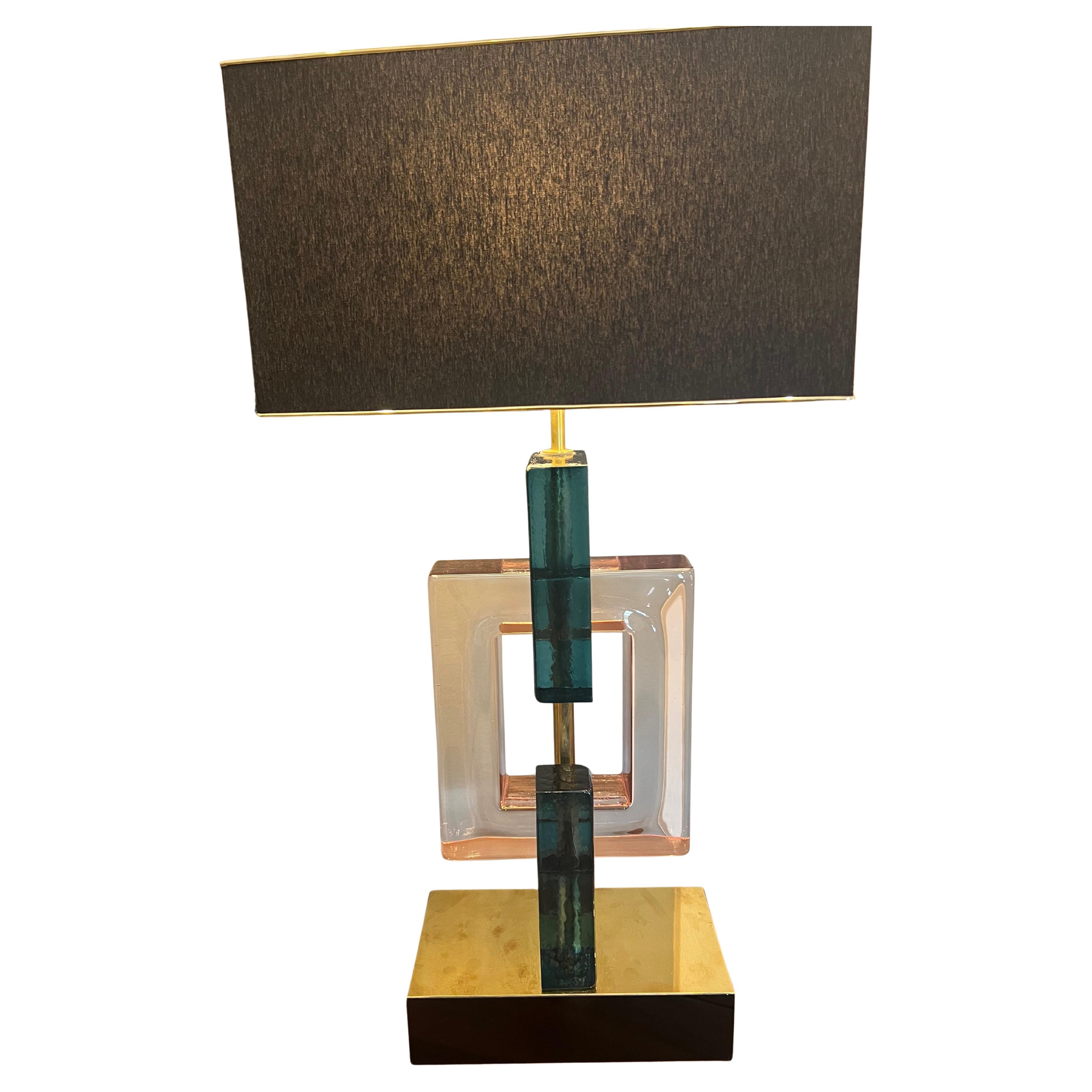 Murano Grand Table Lamps   

    A pair of lamps is made out of Murano glass. The body of each lamp is composed of 3 glass geometrical shapes. Rests on the prominent brass base. 

Condition is very good, rewired.     
Italy, c. 1960s
35” x 18” x