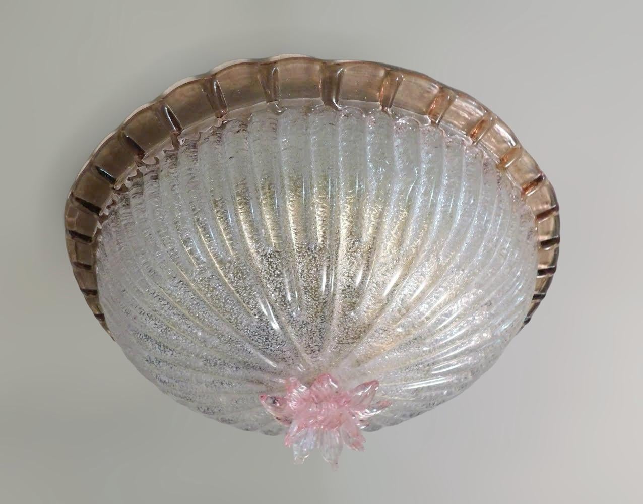 Vintage Italian flush mount with a clear Murano glass diffuser hand blown with granular effect using Graniglia technique, decorated with a brown order and a pink flower in the center / Made in Italy circa 1960s 
Measures: diameter 13 inches, height