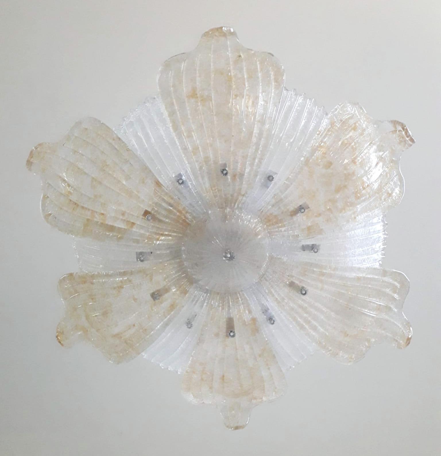 Vintage Italian flush mount with large clear and amber Murano glass leaves hand blown in Graniglia technique to produce granular textured effect, mounted on nickel finish frame / Made in Italy circa 1950s
Measures: diameter 39.5 inches, height 9