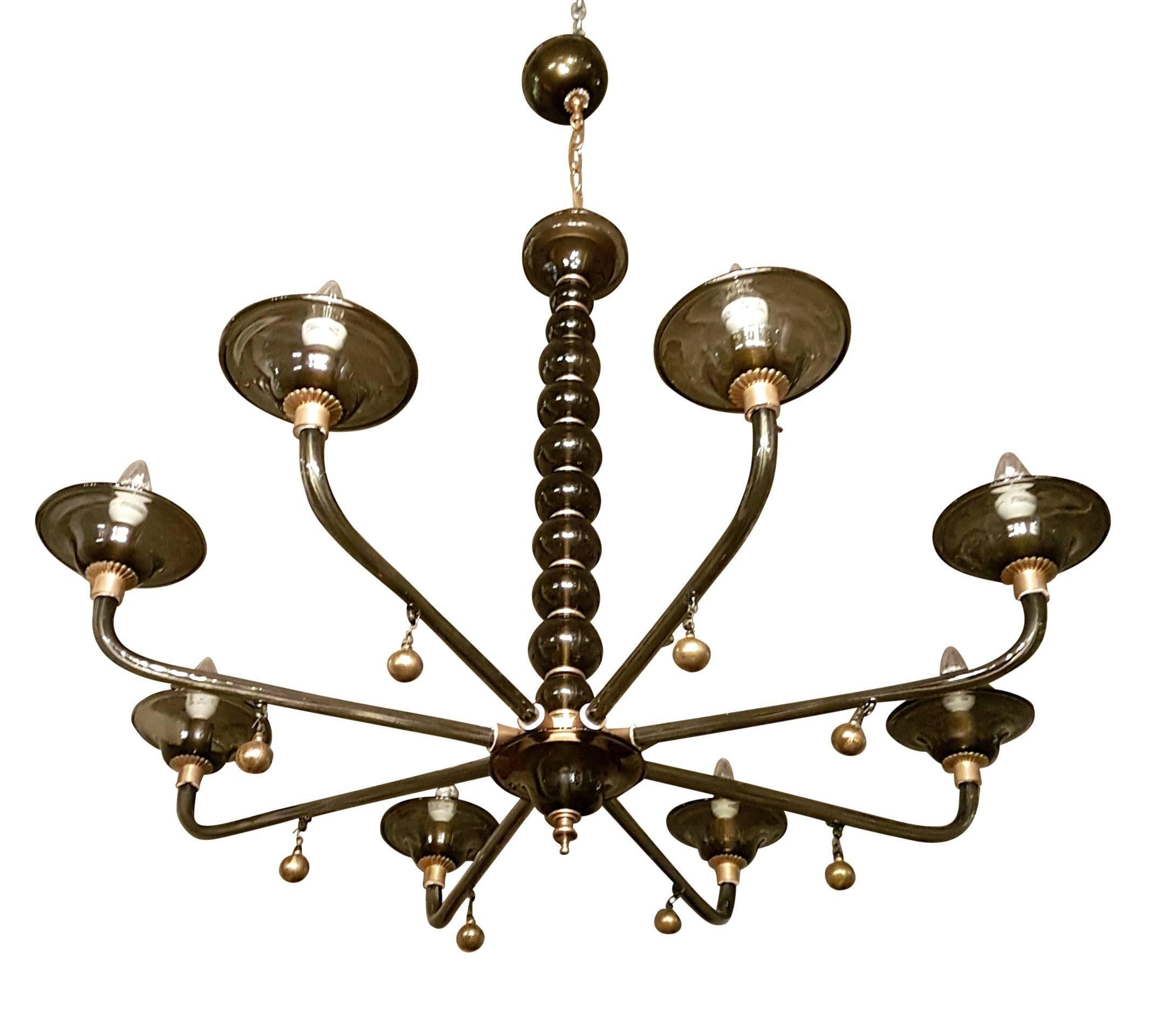Large handblown Murano dark gray and gold leaf flakes glass, eight lights/arms chandelier.
With brass mounts.
It has a brass chain and second canopy, which gives an adjustable height to this chandelier.
Total height with chain: H 50.5 inches, 31