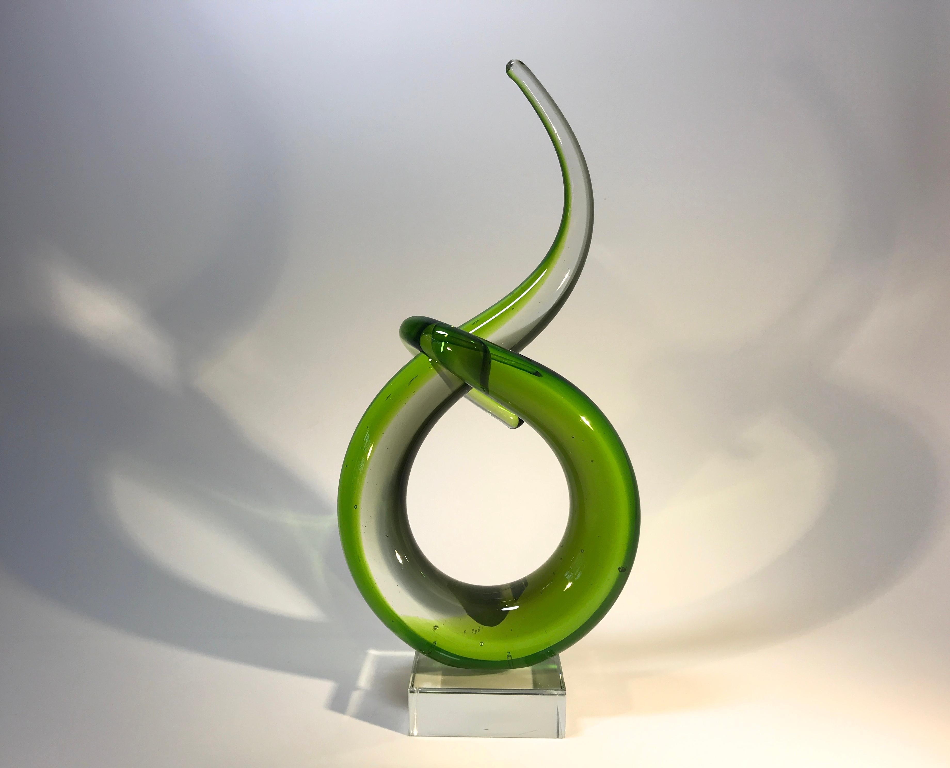 Twisted and abstract, green Murano of Italy glass sculpture from the 1960s
A quiet and calming piece of entwined Murano
Stands on a clear square plinth,
circa 1960s
Measures: Height 10 inch, width 5 inch, depth 2.5 inch
Very good condition with a