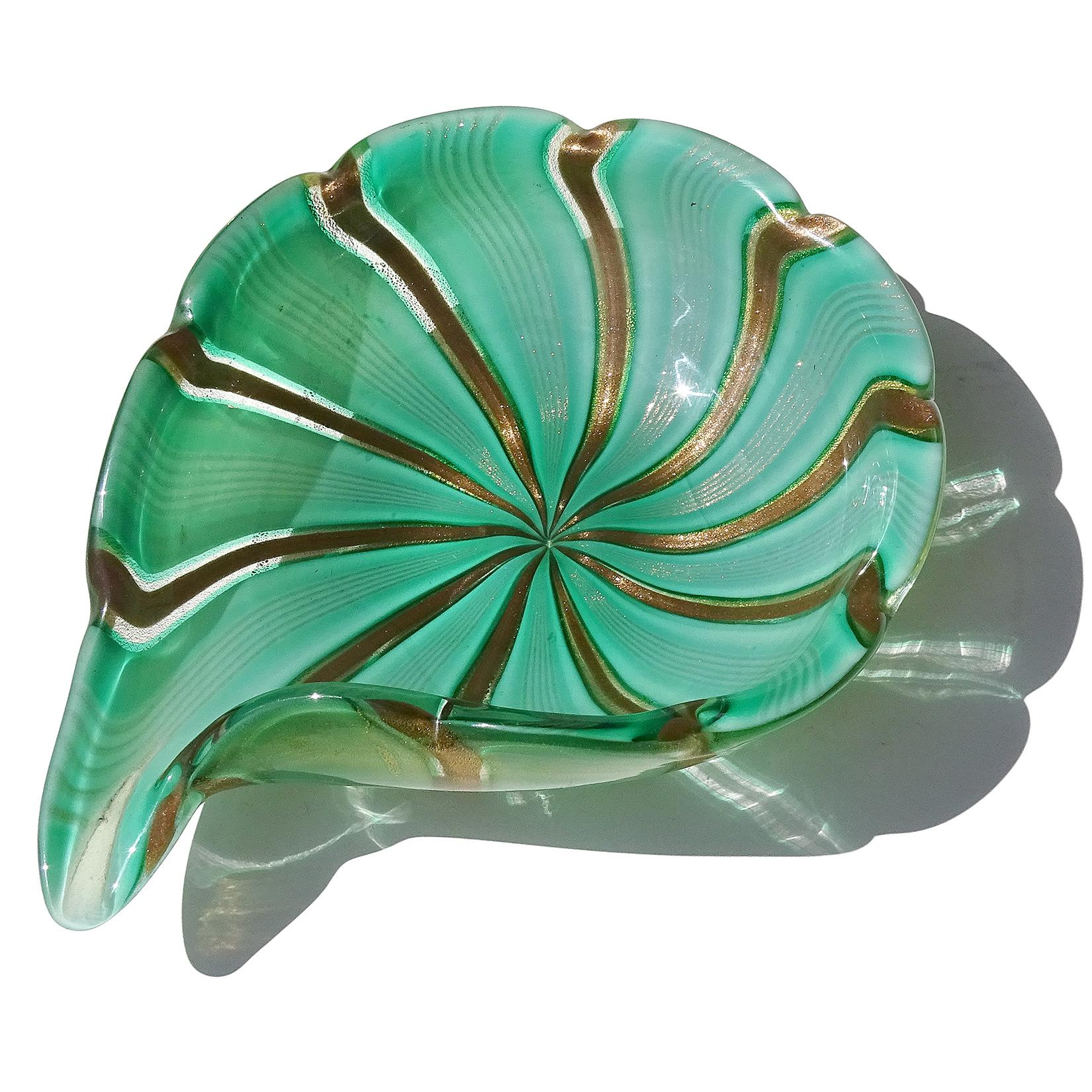 Beautiful vintage Murano hand blown green, aventurine and gold flecks Italian art glass decorative bowl. Attributed to designer Dino Martens for Aureliano Toso. The bowl is made with large 