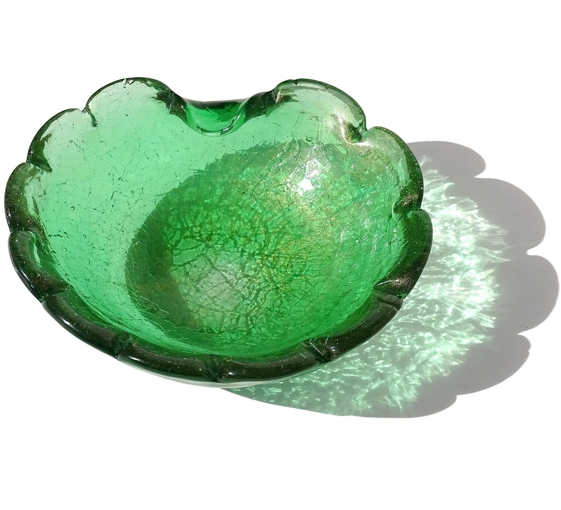 Beautiful vintage Murano hand blown green, crackle surface and gold flecks Italian art glass bowl. Created in a crackle glass surface pattern with scallop design on the rim. The piece has a decorative indent on the rim that could be used as a