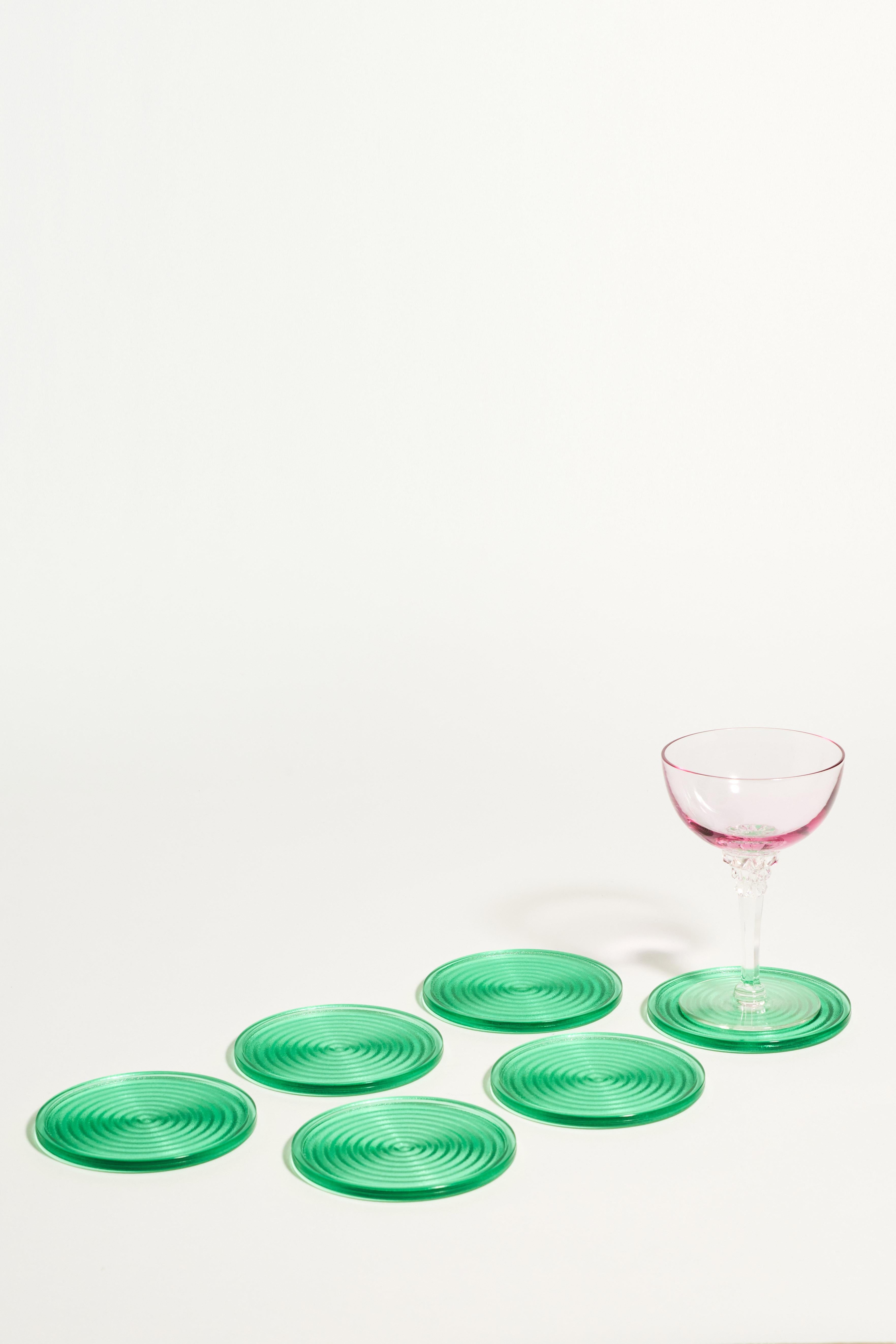 Set of six Murano glass coasters with a concentric circular pattern in sea green glass.