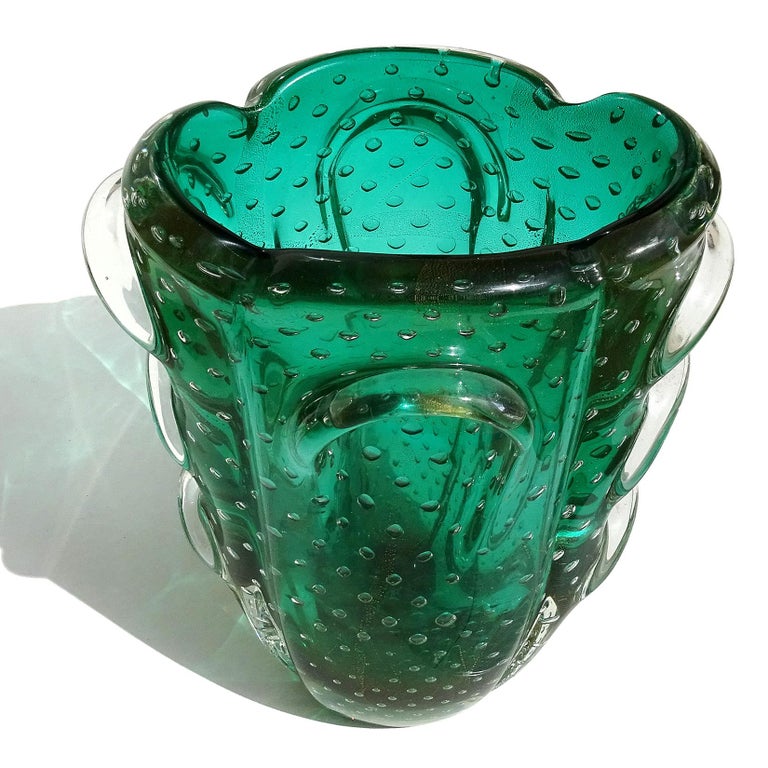 Beautiful, large and rare Murano hand blown green, controlled bubbles and gold flecks Italian art glass pulled glass sculptural flower vase. Attributed to designers Flavio Poli and Archimede Seguso for Seguso Vetri D' Arte, circa 1930-40s. Would