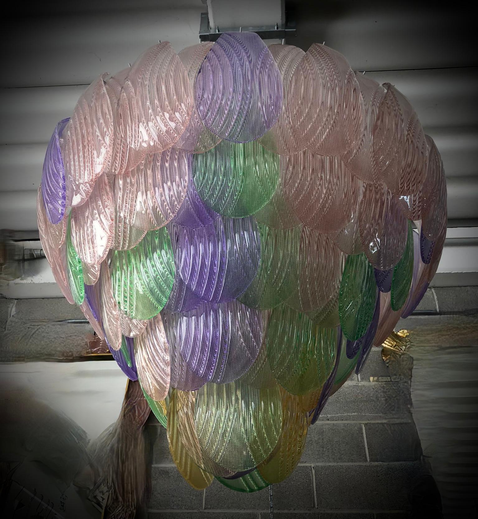 Fantastic Venetian green pink yellow and violet color for a Cascade of Murano leaves. A striking color for this chandelier. The Murano furnaces create an indisputable timeless design, simple but elegant at the same time.

All in Murano art glass