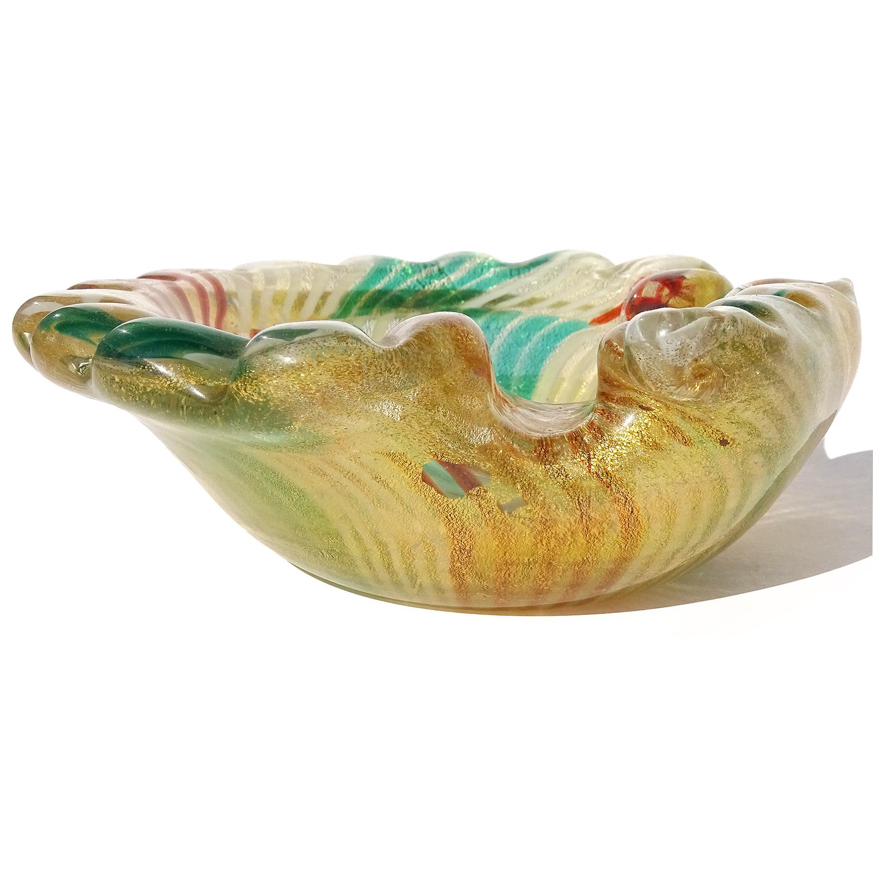 Beautiful vintage Murano hand blown green, white and red-orange stripes mosaic pieces and gold flecks Italian art glass sculptural fan shape conch / seashell bowl. The pattern of the bowl is made with alternating glass blocks or patchwork 