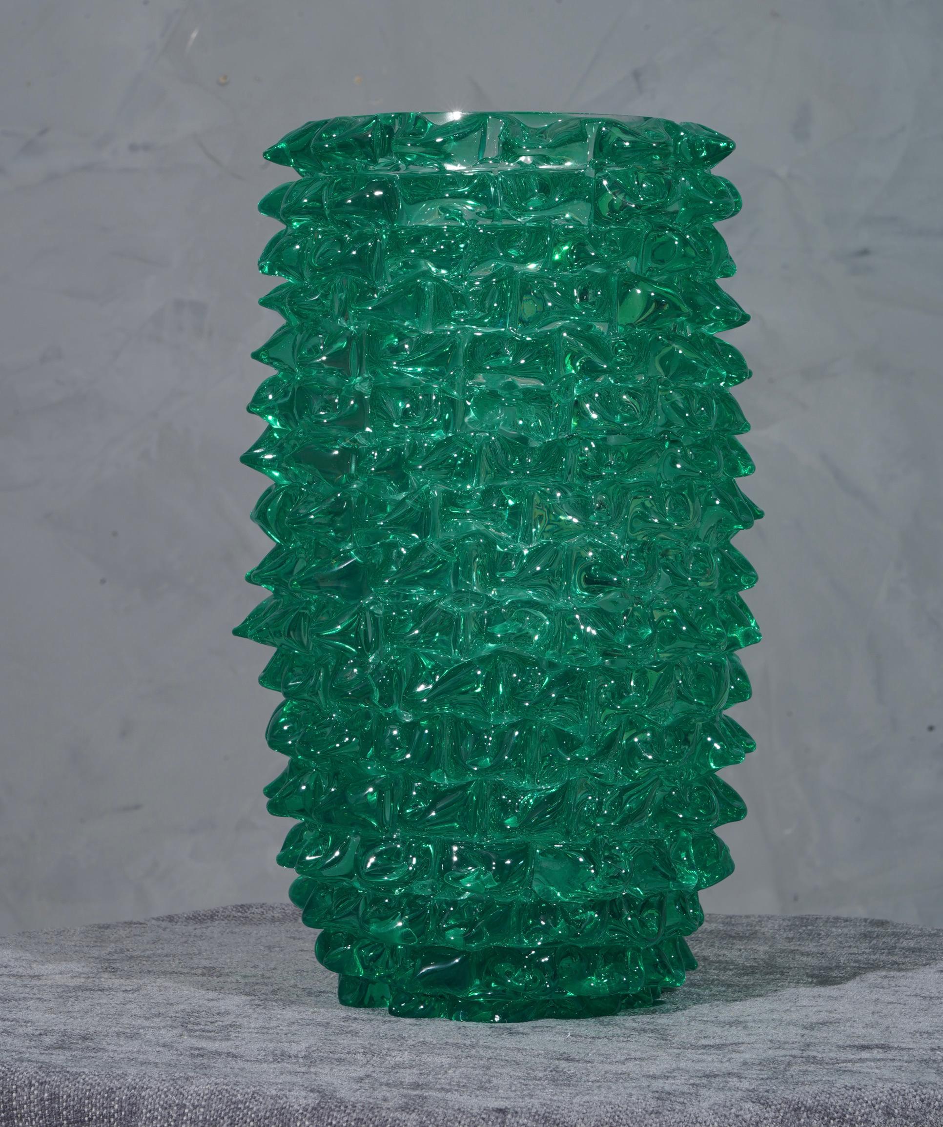 Fantastic vase from the Murano glassworks, both for its special processing and for its color, in fact the vase is green.

Murano vase, with a special workmanship all around. Vase of round shape, with a particular manual processing called 