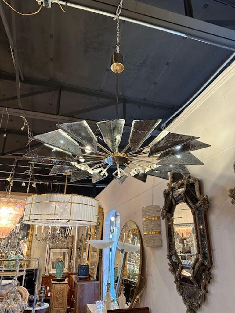 Modern Murano glass and brass helicopter chandelier in Fontana green, Circa 2000. The chandelier has been professionally rewired, comes with matching chain and canopy. It is ready to hang!