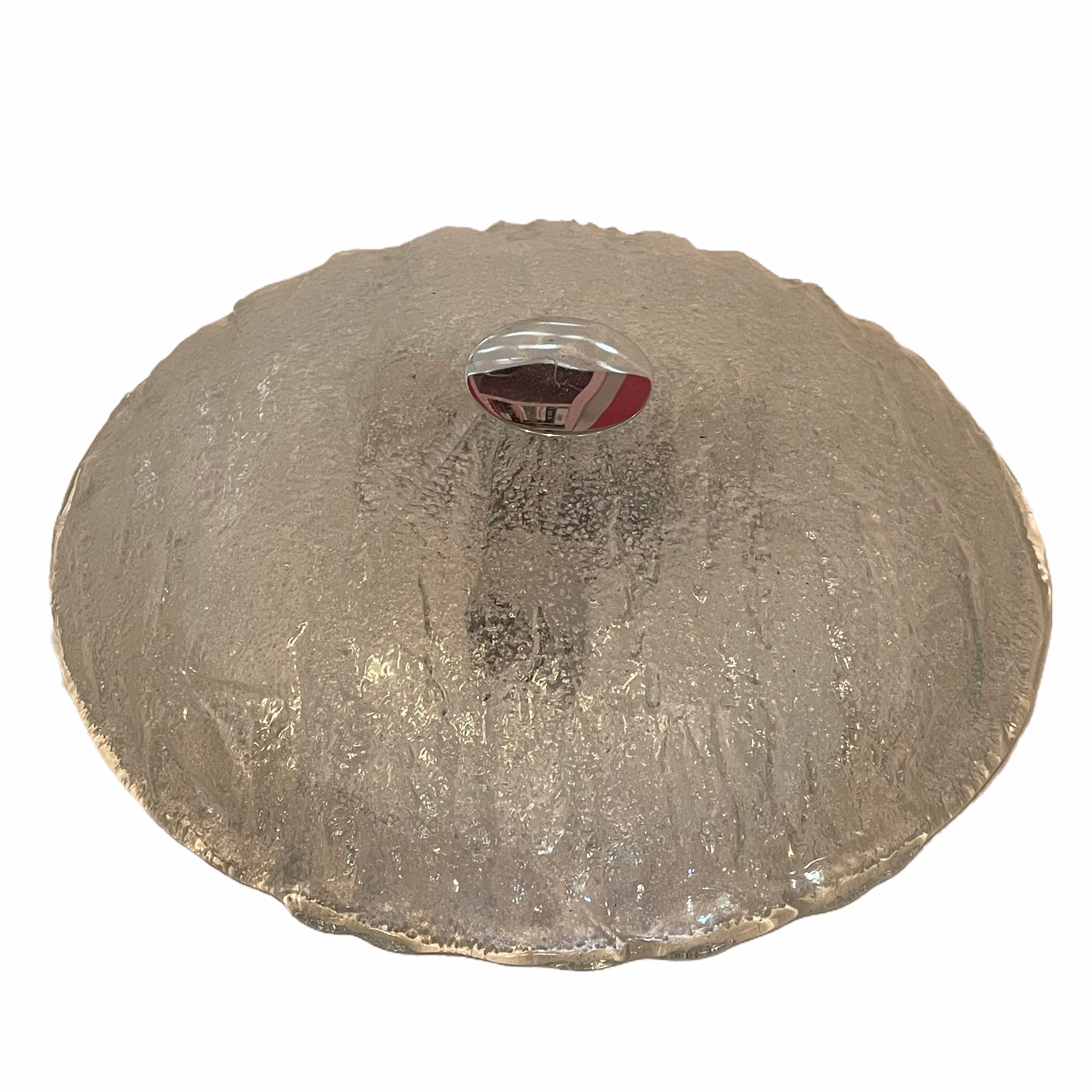 Beautiful flush mount with a heavy textured Murano glass on a metal fixture. The Murano glass is fixed with a brass screw on the metal fixture. It requires three European E14 / 110 Volt candelabra bulbs, each bulb up to 40 watts. Made by Honsel
