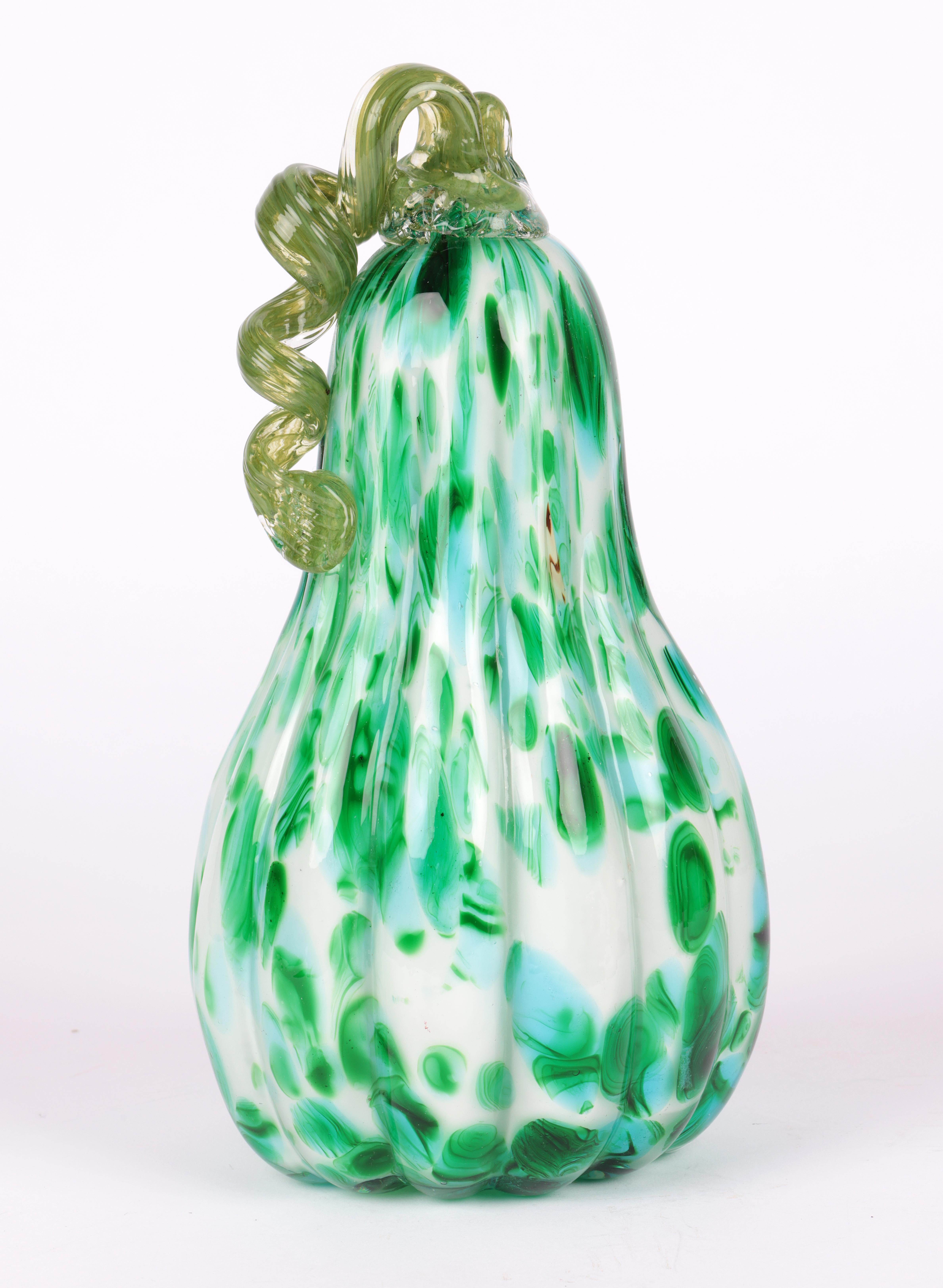 A stylish Italian Murano large green art glass gourd dating from the latter 20th century. The hand-blown gourd is of tall shape with a wide rounded base and ribbed body narrowing to the top and applied with a trailing green glass stem attached with