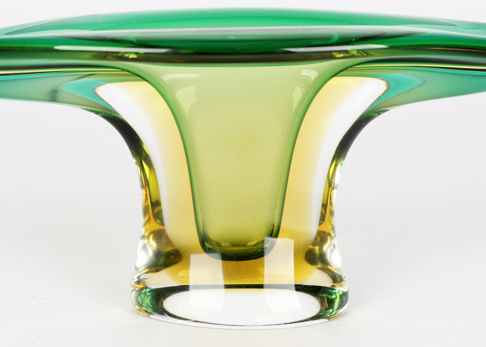 A stunning Italian Murano sommerso green and yellow glass bowl of stylized gondola design dating from around 1960/70. The heavily made bowl stands raised on a narrow oval rising pedestal foot with the top formed in the shape of a gondola with raised