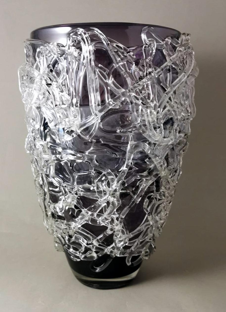 We kindly suggest that you read the entire description, as with it we try to give you detailed technical and historical information to guarantee the authenticity of our objects.
Original and unique Murano vase made of violet-colored blown glass with