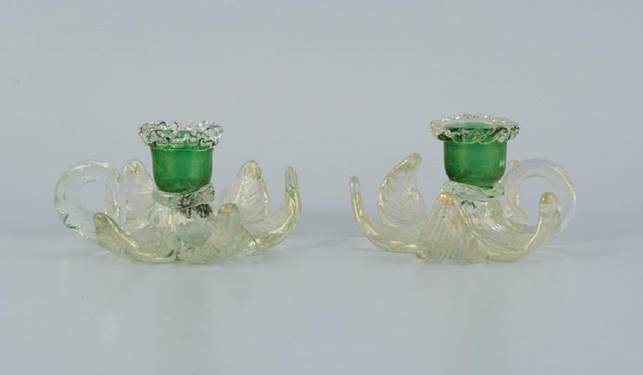 Murano, Italy.
A pair of low candlesticks in green and clear art glass.
1960/70s.
In perfect condition.
Dimensions: H 6.0 x D 10.0 cm.
