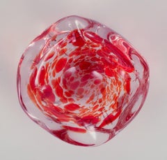 Murano, Italy. Art glass bowl. Clear and red glass with air bubbles inside.