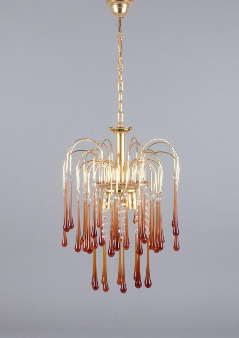 Murano, Italy. Ceiling lamp in amber mouth-blown art glass, brass frame. 
Italian design.
1960s.
In perfect condition.
Dimensions: H 57.0 cm without suspension x D 40.0 cm.