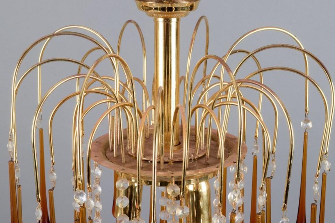 Mid-20th Century Murano, Italy. Ceiling lamp in amber mouth-blown art glass, brass frame.  For Sale
