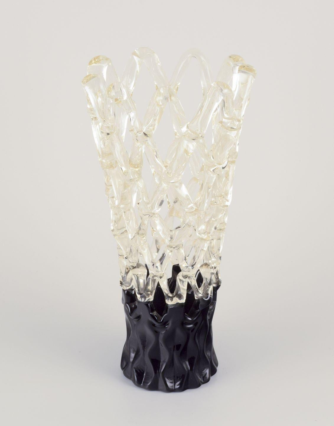 Pre-owned goods are exempt from import duties for U.S. customers. 
Therefore, no import tariffs will be applicable to your purchase.

Murano, Italy.
Exclusive Murano art glass vase with a refined lattice design.
Black and clear glass.