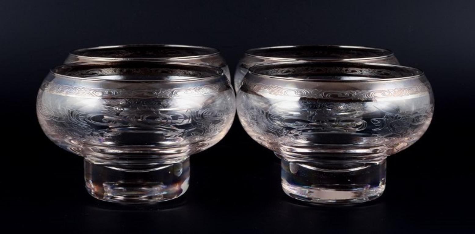 Murano, Italy, four mouth-blown and engraved glass fingerbowls with silver rim.
Mid-20th century.
In perfect condition.
Dimensions: D 14.0 x H 9.0 cm.